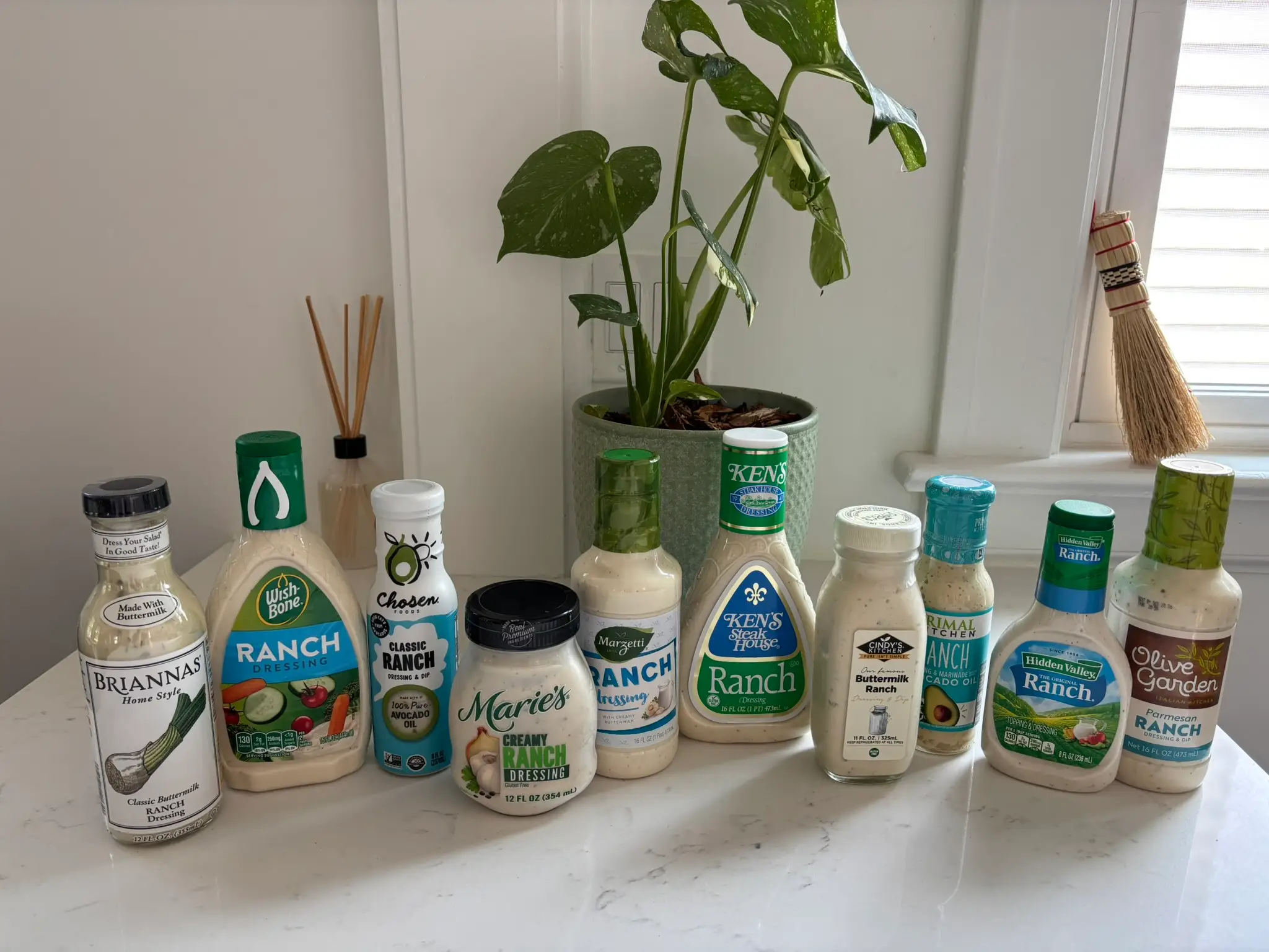 Bottles of ranch dressing lined up on counter