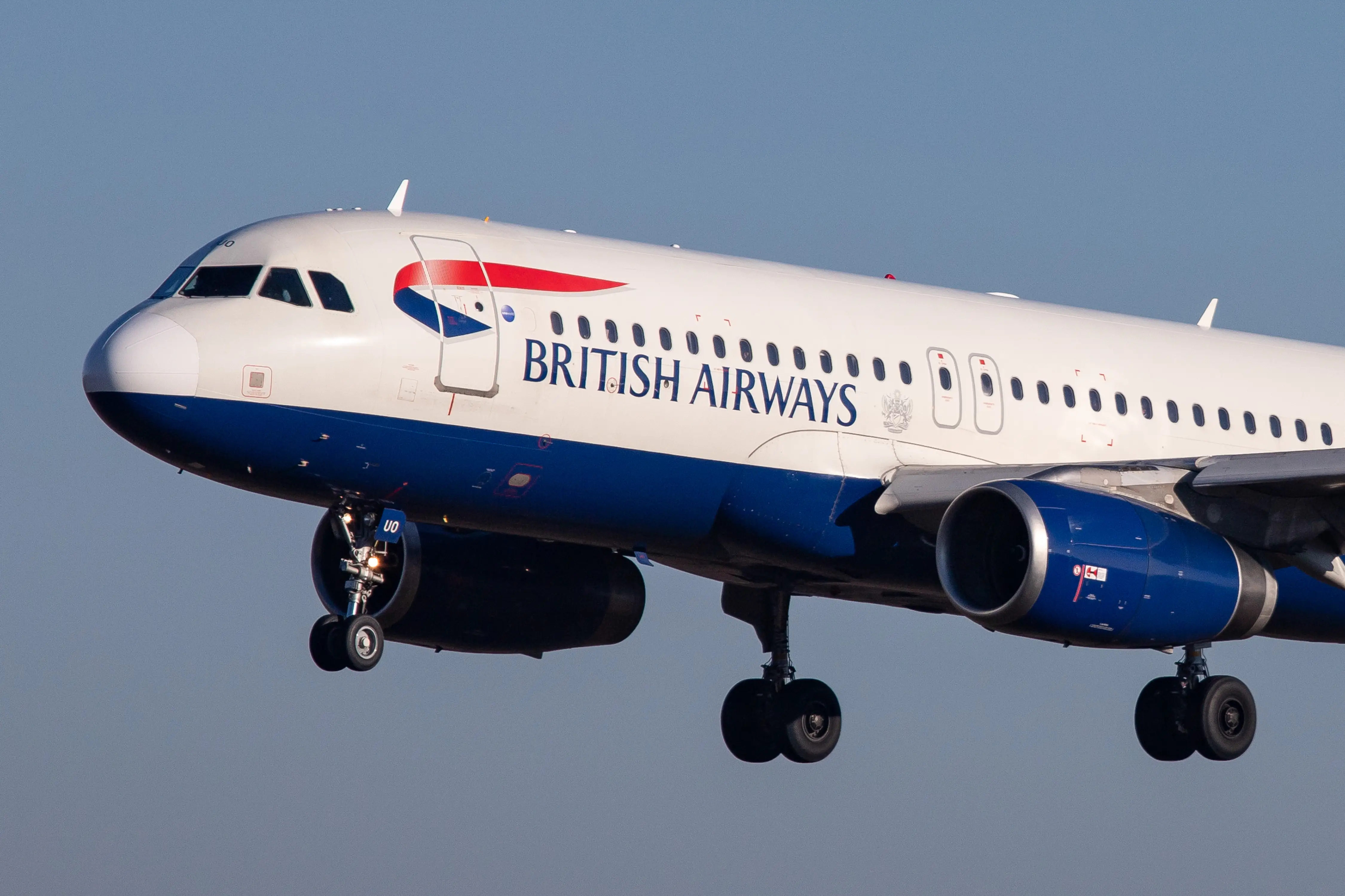 British Airways Airbus A320-200 with registration G-EUUO landing at Luxembourg Findel International Airport LUX ELLX in the blue sky.