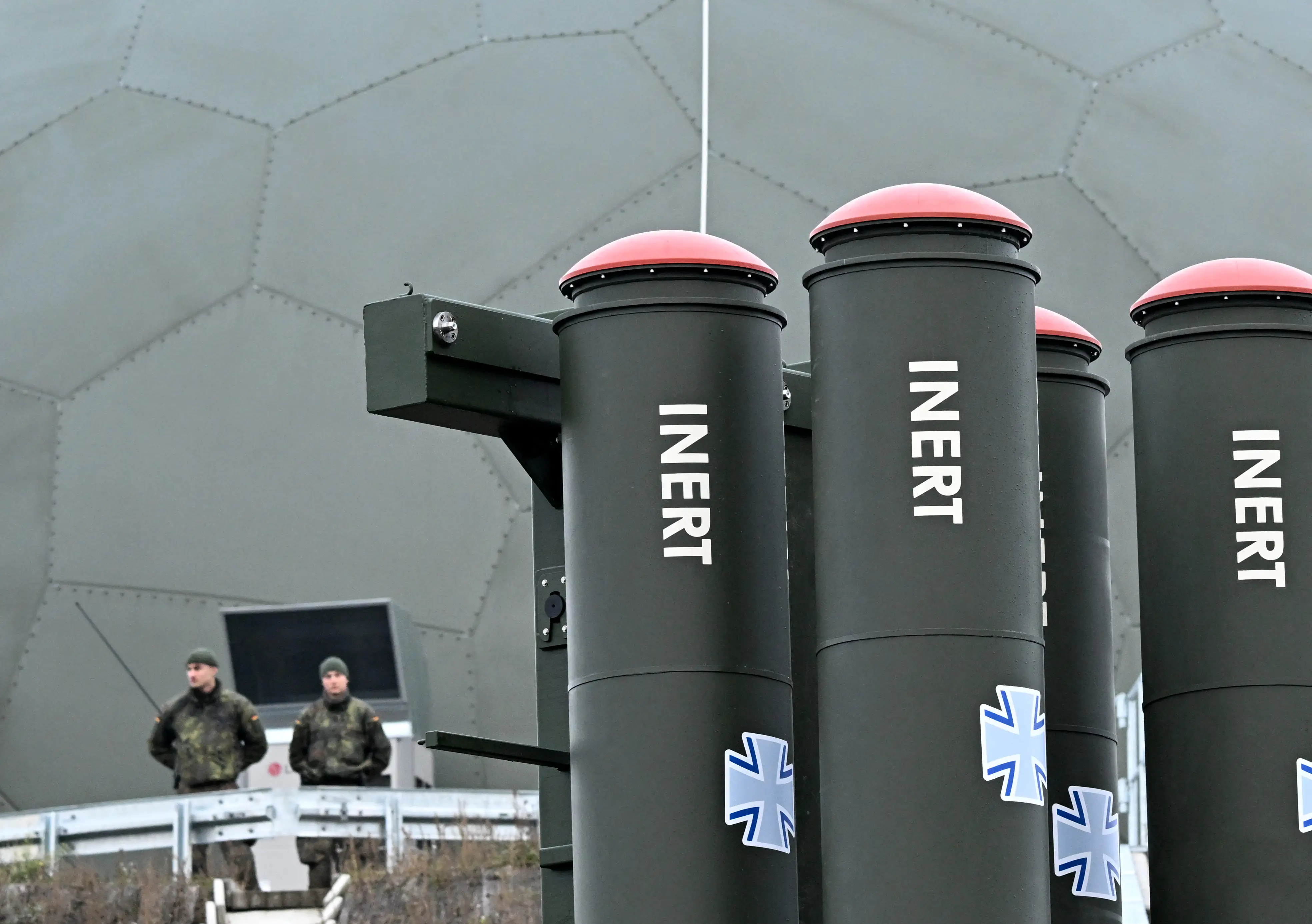 German soldiers stand behind the Arrow 3 shield system during an event of the German Air Force to declare the Initial Operating Capability for the Arrow Weapon System for Germany at the Annaburger Heide Air Base in eastern Germany, on December 3, 2025.
