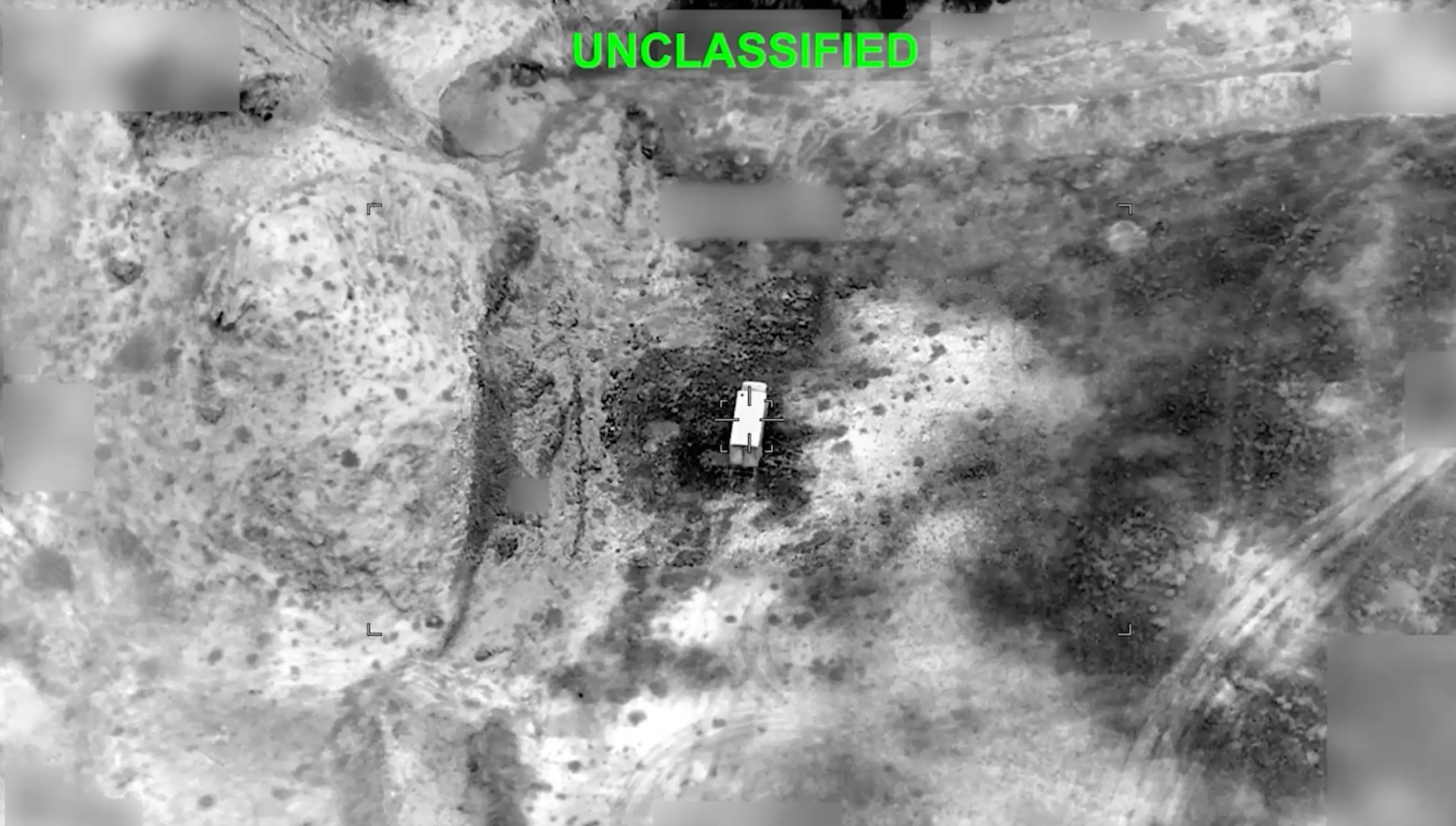 A black and white image of an Iranian military target seconds before the US dropped a munition on it.