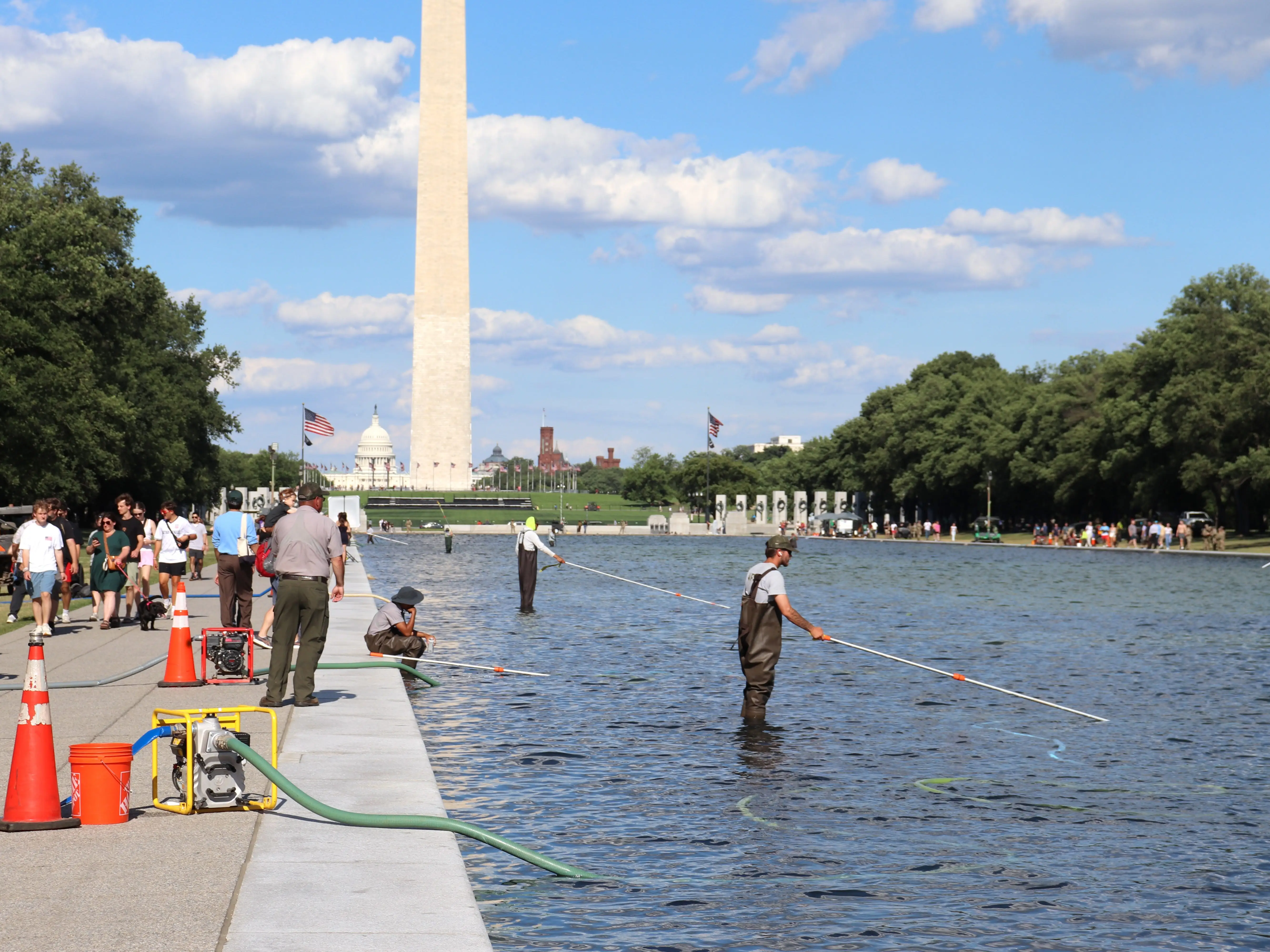 National Park Service worker cleaning reflecting pool in Washington, DC, on June 19, 2026