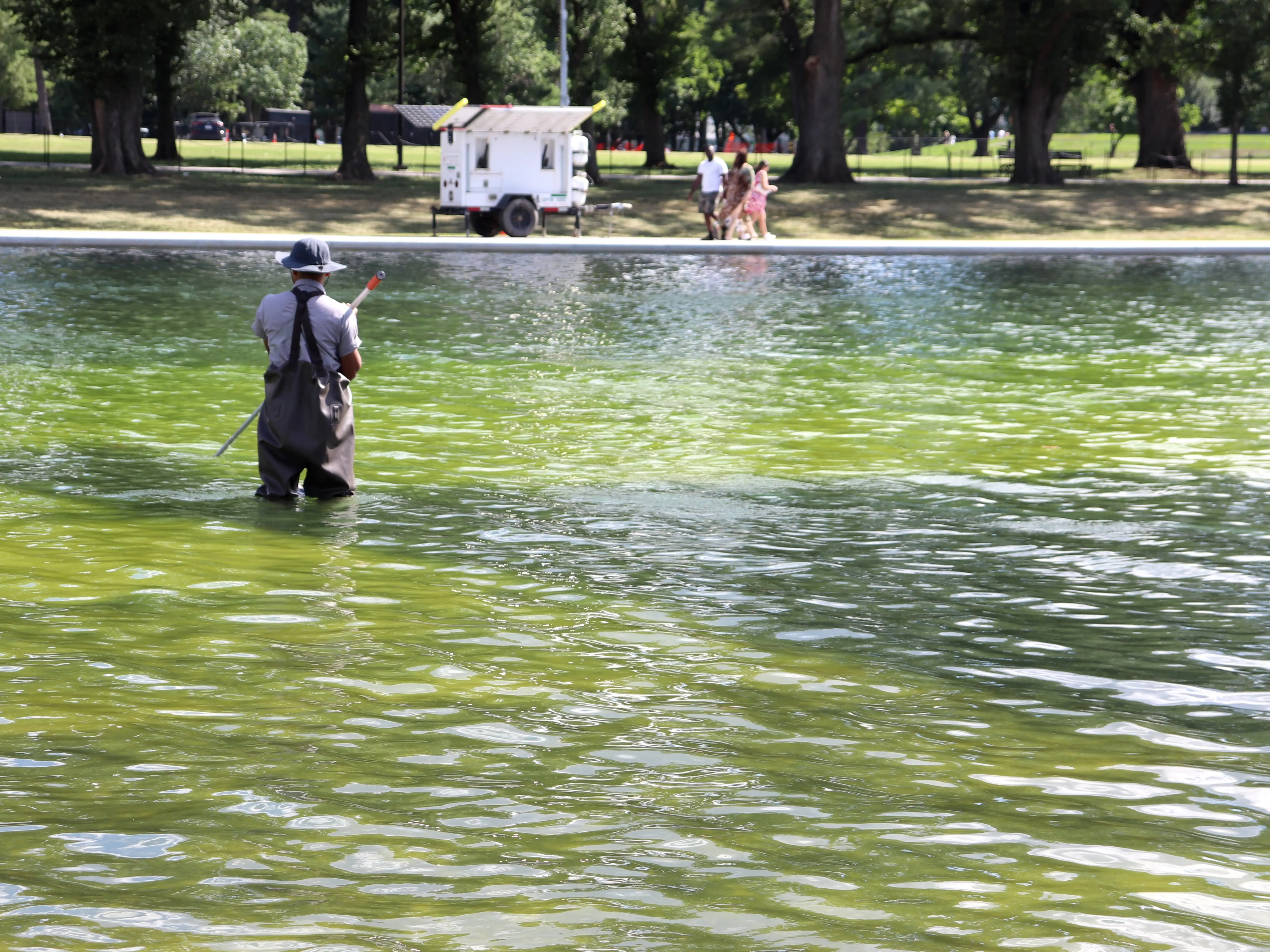 National Park Service worker cleaning reflecting pool in Washington, DC, on June 19, 2026