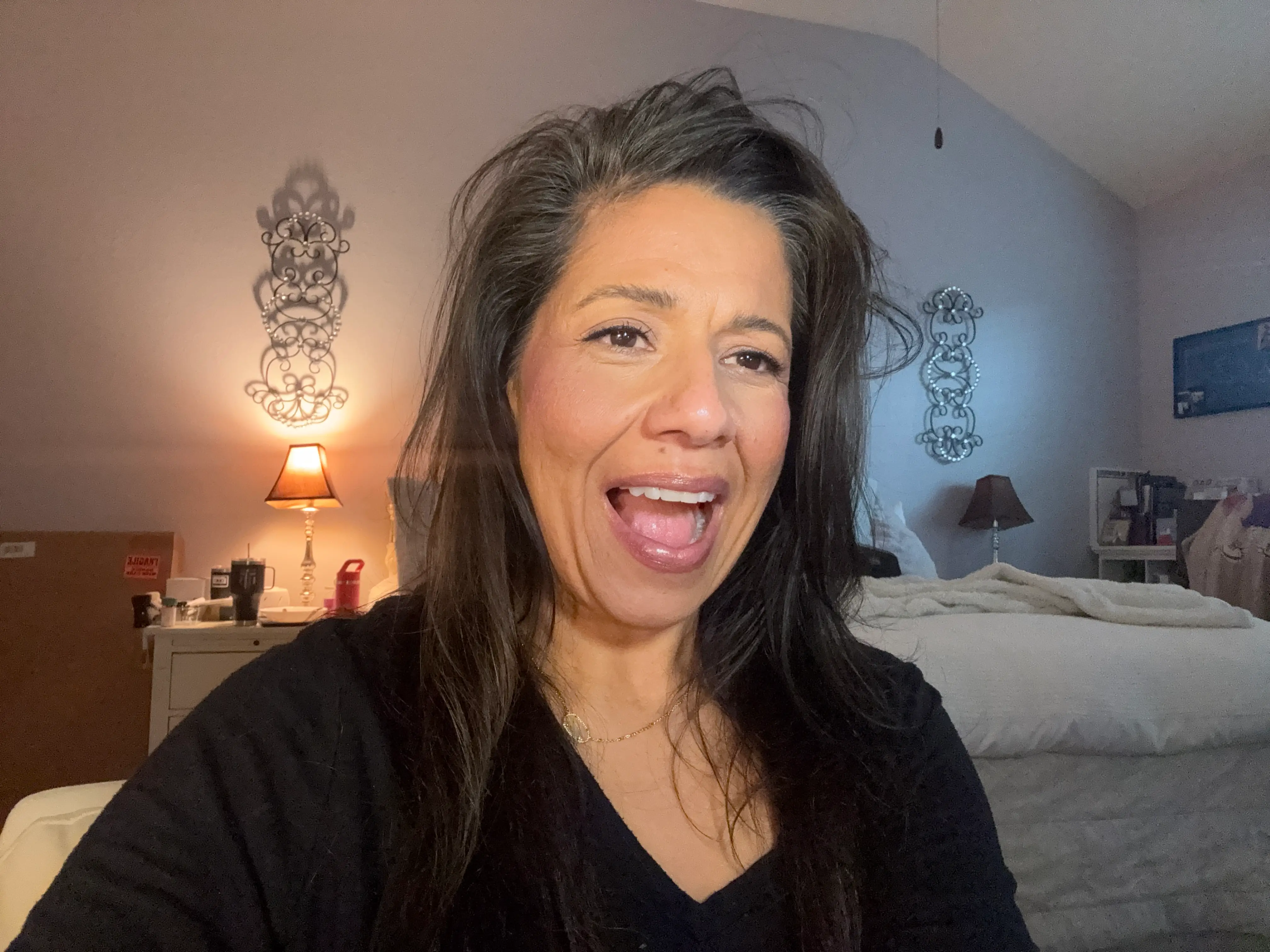 Author Suzie Jimenez smiling with Korean skincare products