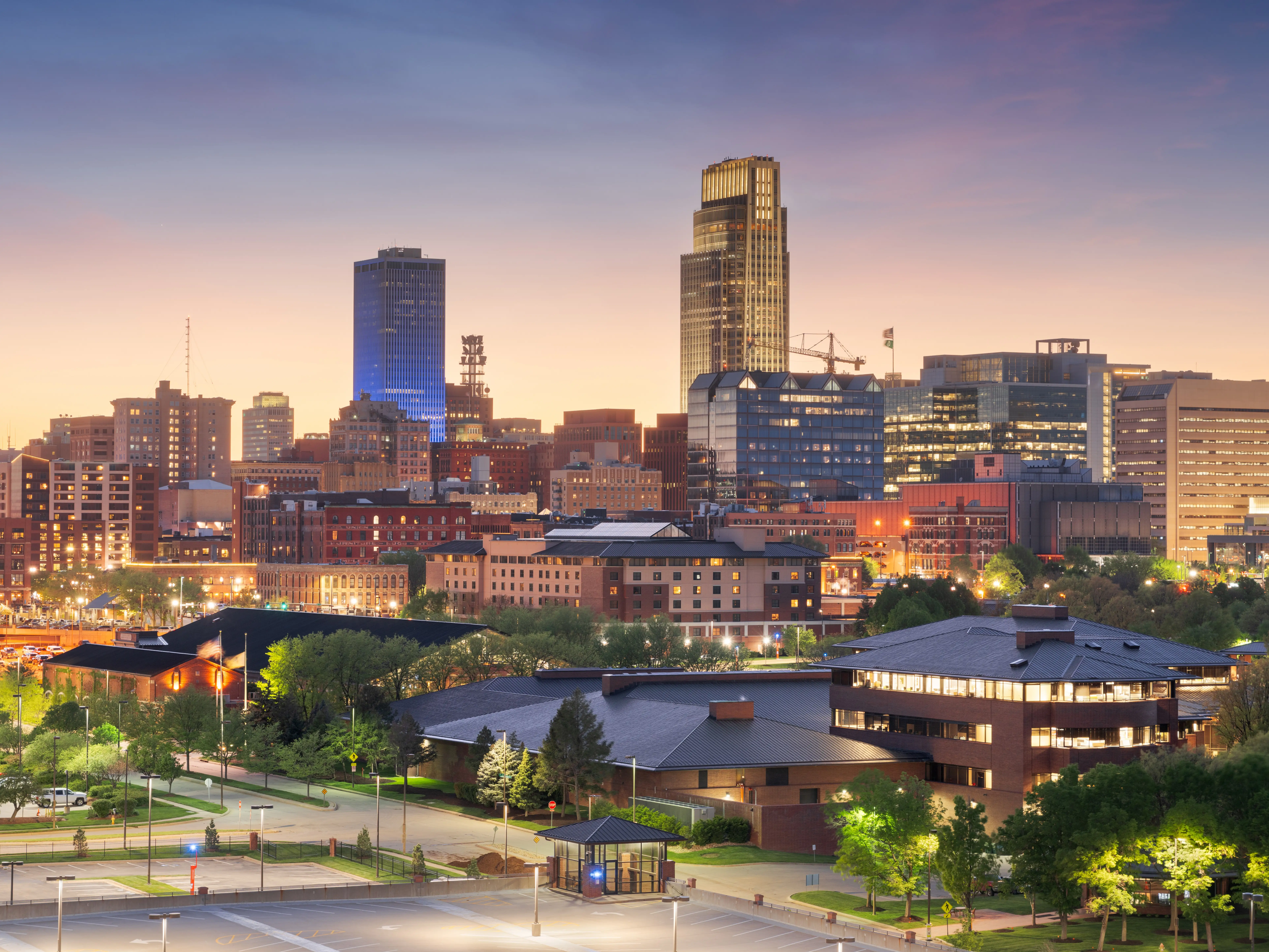 Omaha, Nebraska, USA downtown cityscape at dusk.