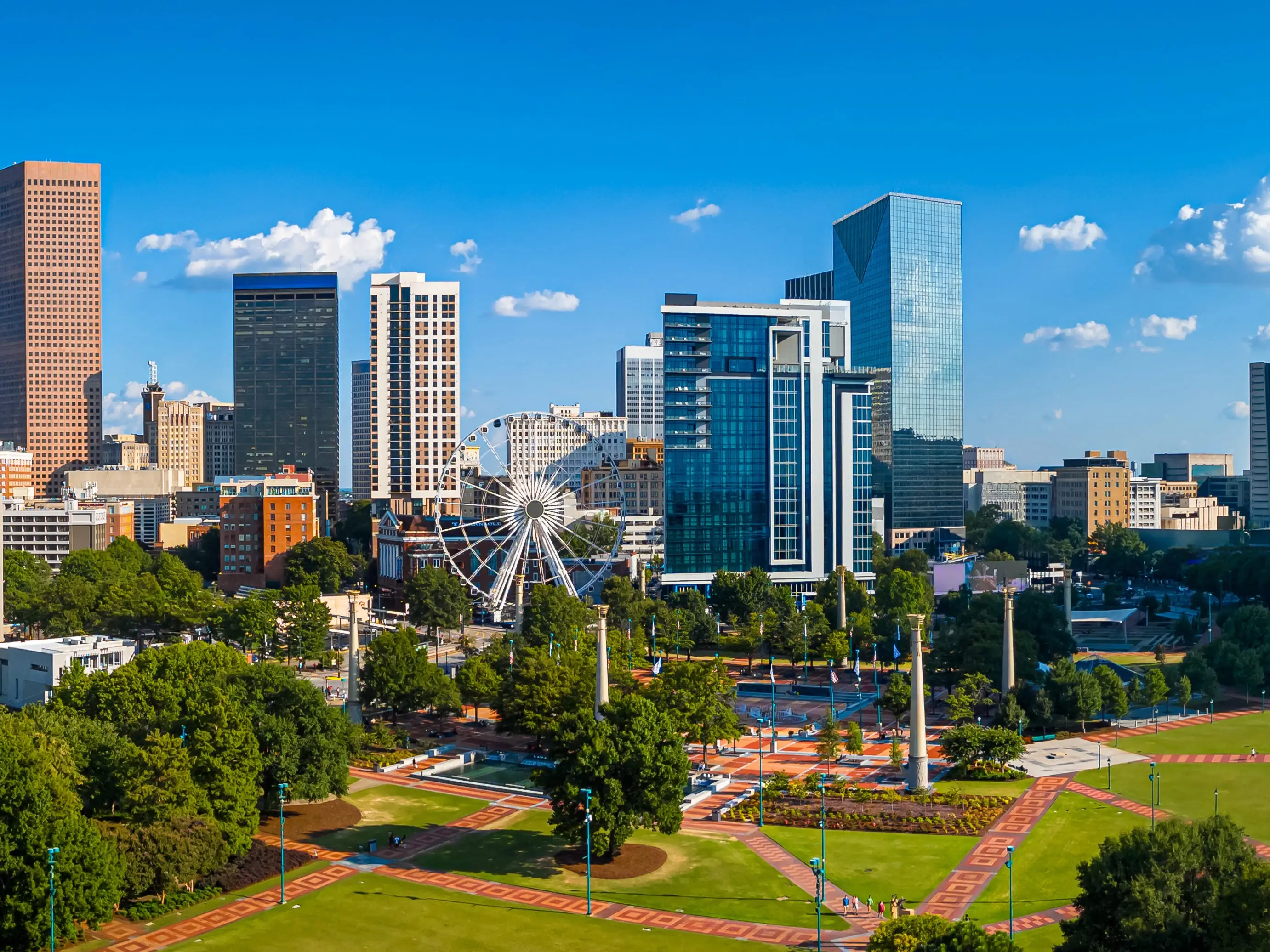 Atlanta Skyline with Midtown Towers Above Lush Urban Park in Summer Light