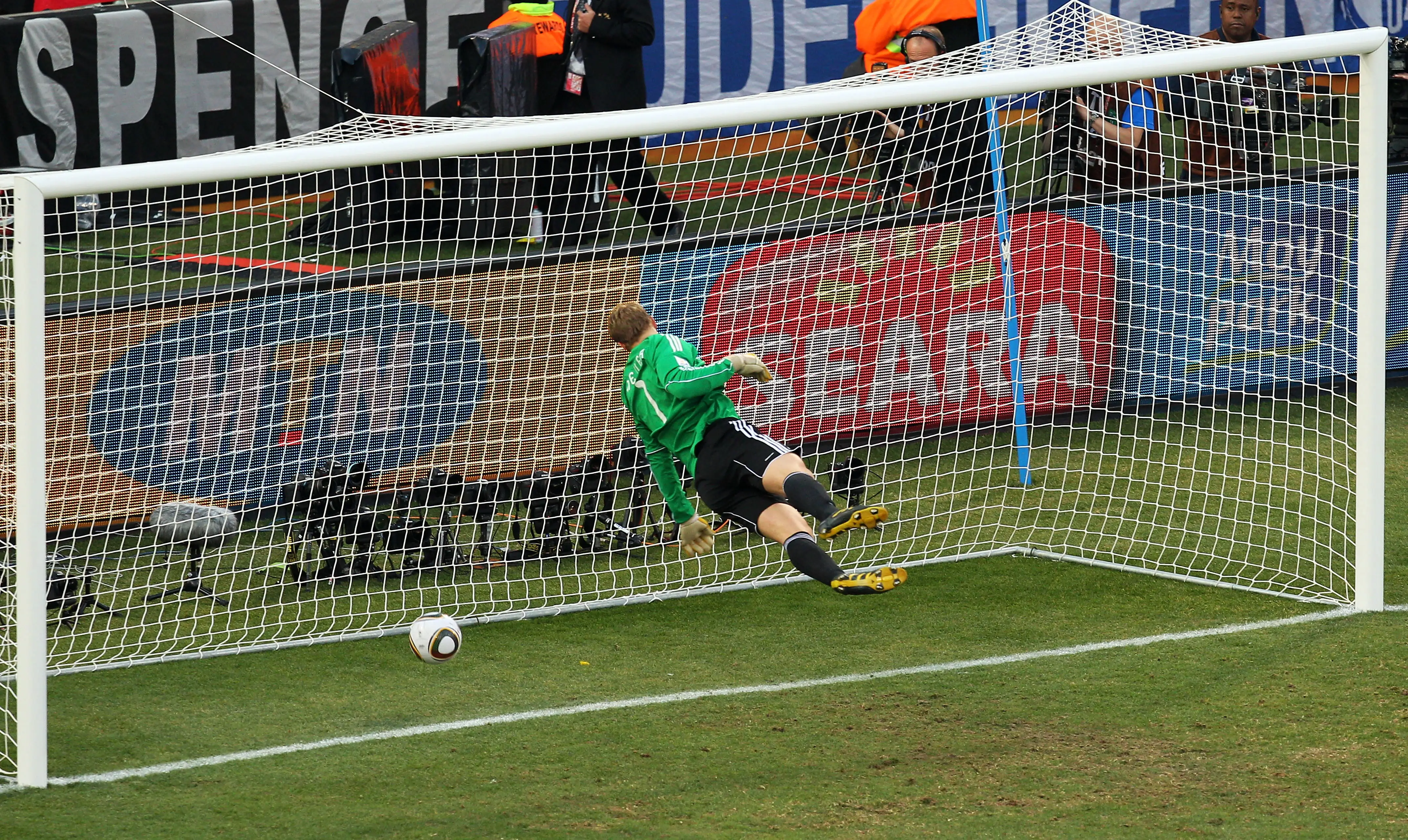 Manuel Neuer of Germany watches the ball bounce over the line from a shot that hit the crossbar from Frank Lampard of England, but referee Jorge Larrionda judges the ball did not cross the line during the 2010 FIFA World Cup