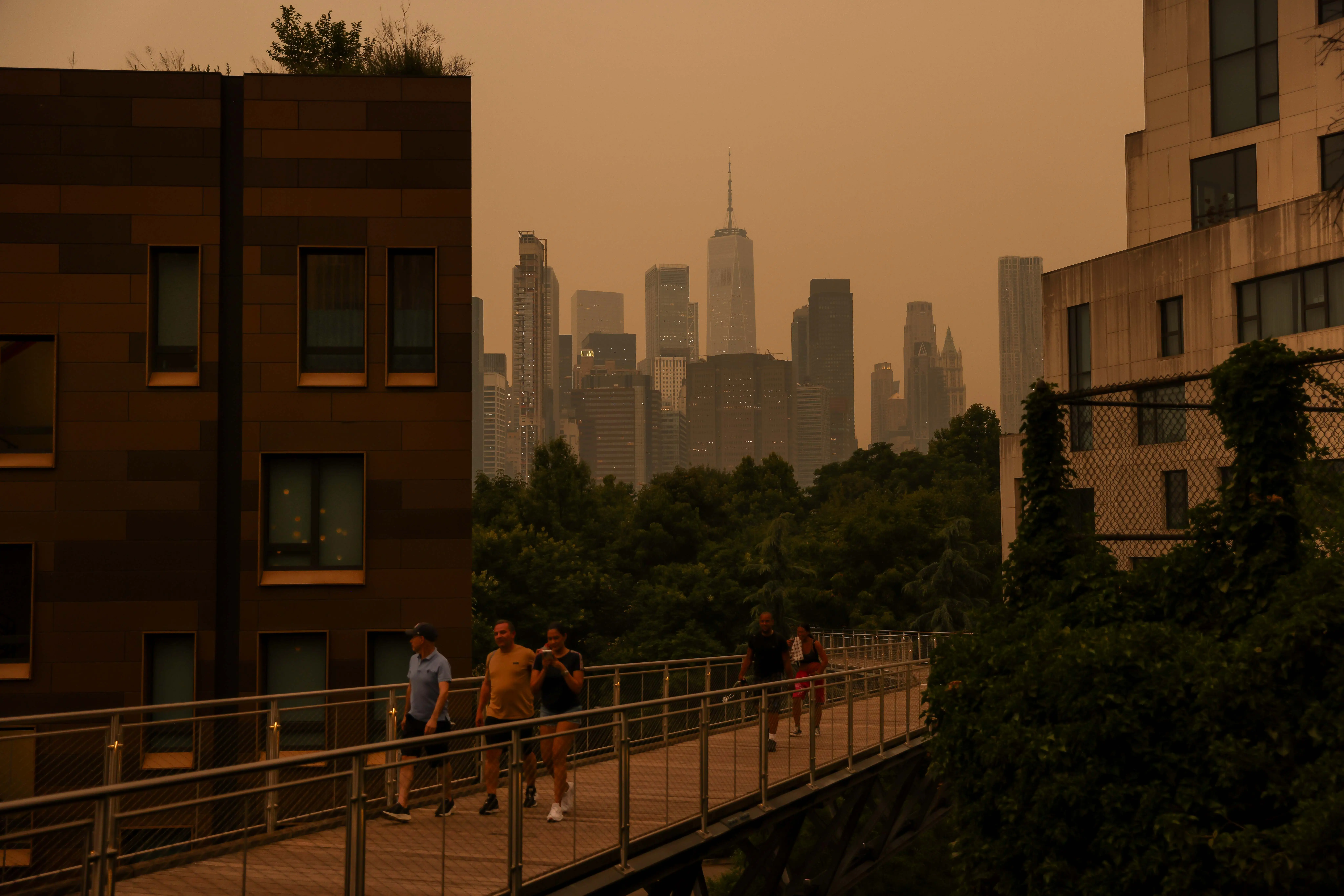 Smoke from wildfires in Canada shrouds the Manhattan skyline in the Brooklyn borough of New York, US, on Wednesday, July 15, 2026.