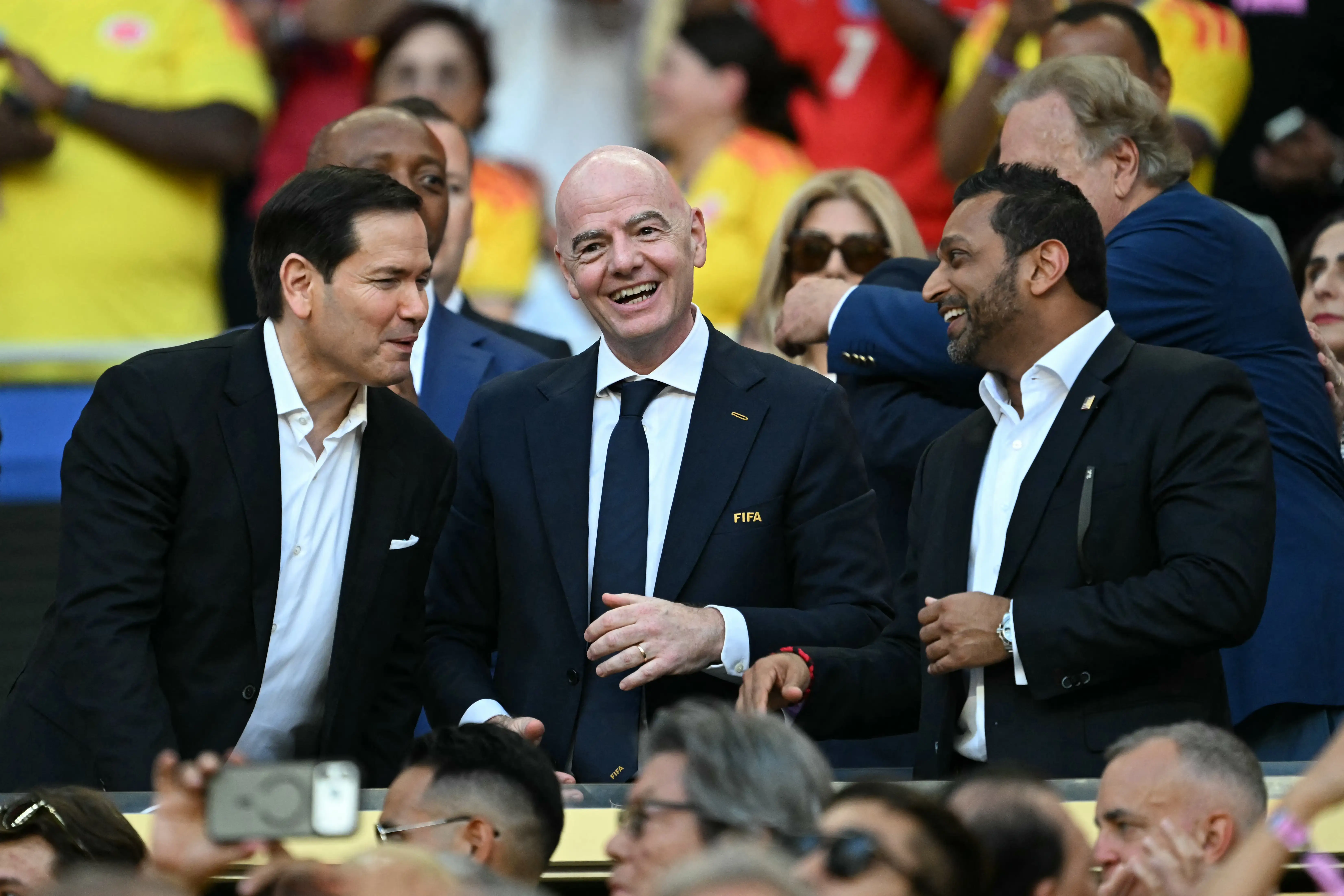 US Secretary of State Marco Rubio (L), FIFA President Gianni Infantino (C), and FBI Director Kash Patel (R) talk ahead of the 2026 World Cup Group K football match between Colombia and Portugal at the Miami Stadium in Miami Gardens on June 27, 2026.