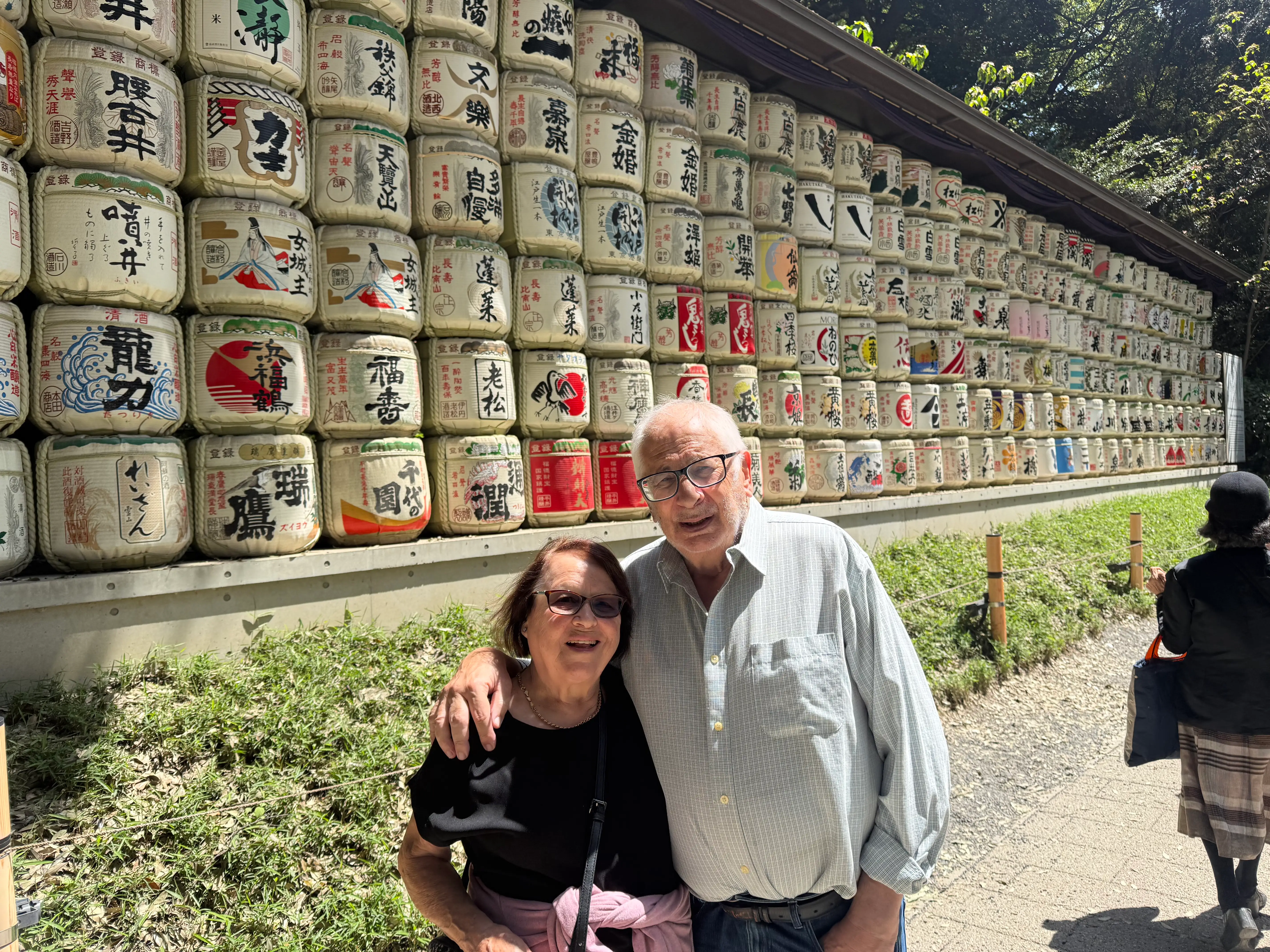 Older couple posing outside of a temple in Japan