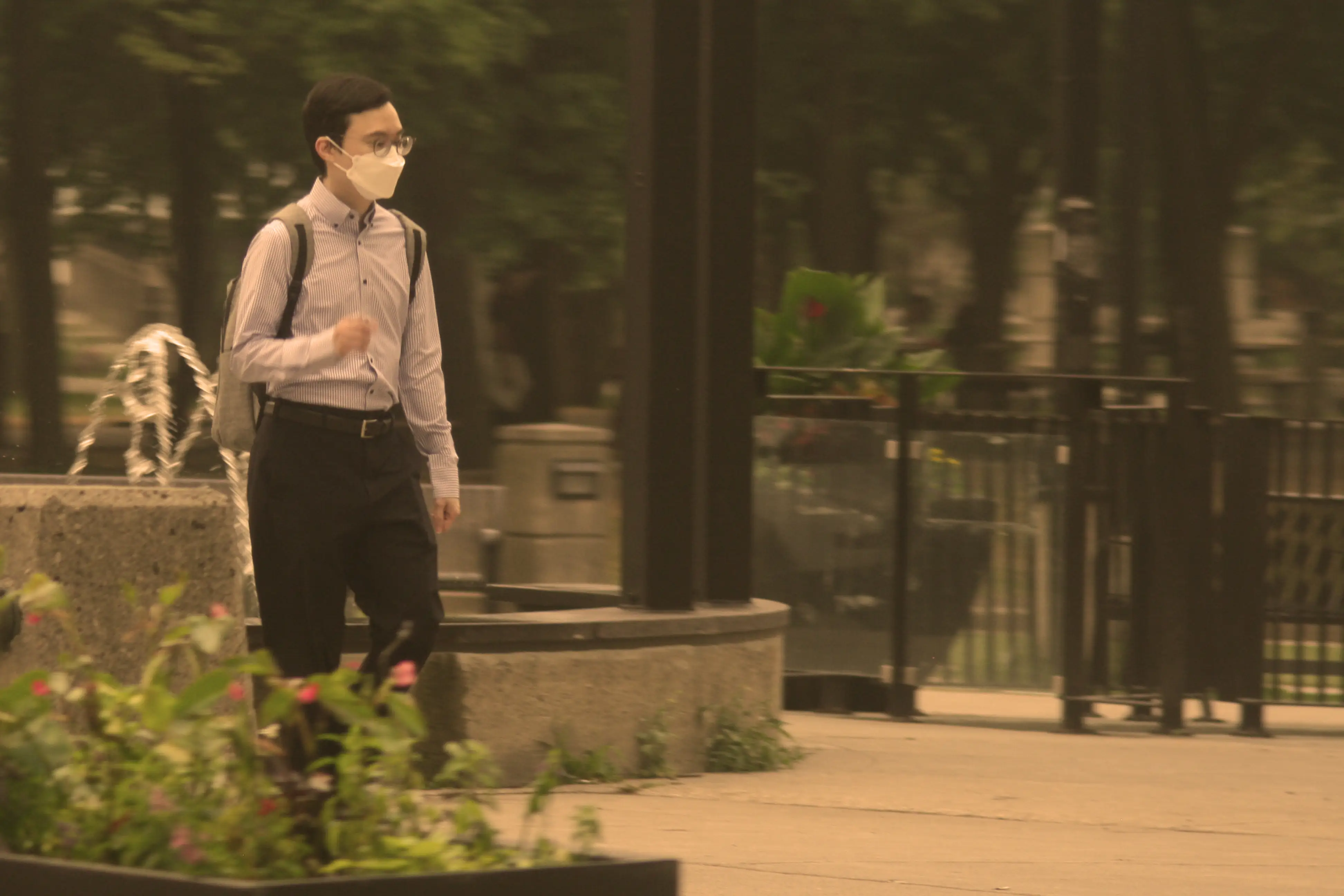 A man wearing a face mask during wildfires.