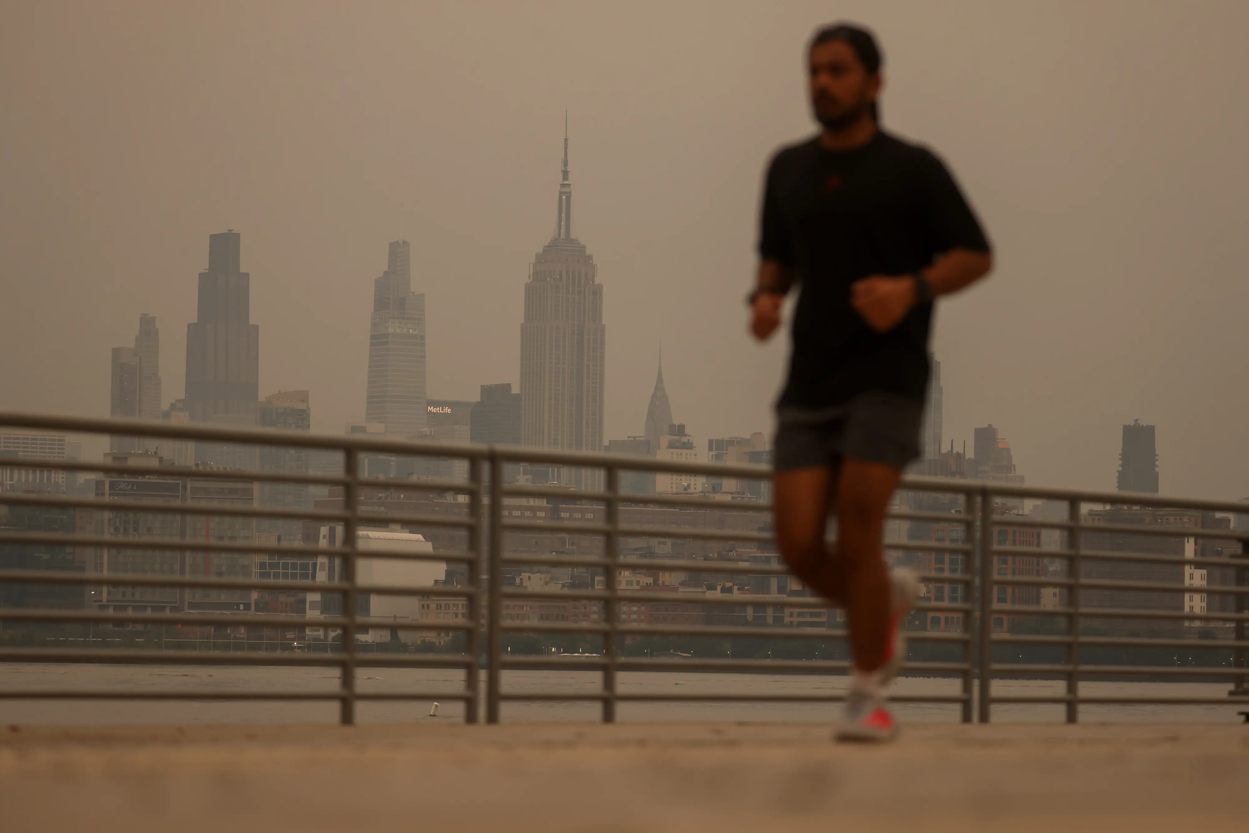 A jogger in New York City amid wildfire smoke.