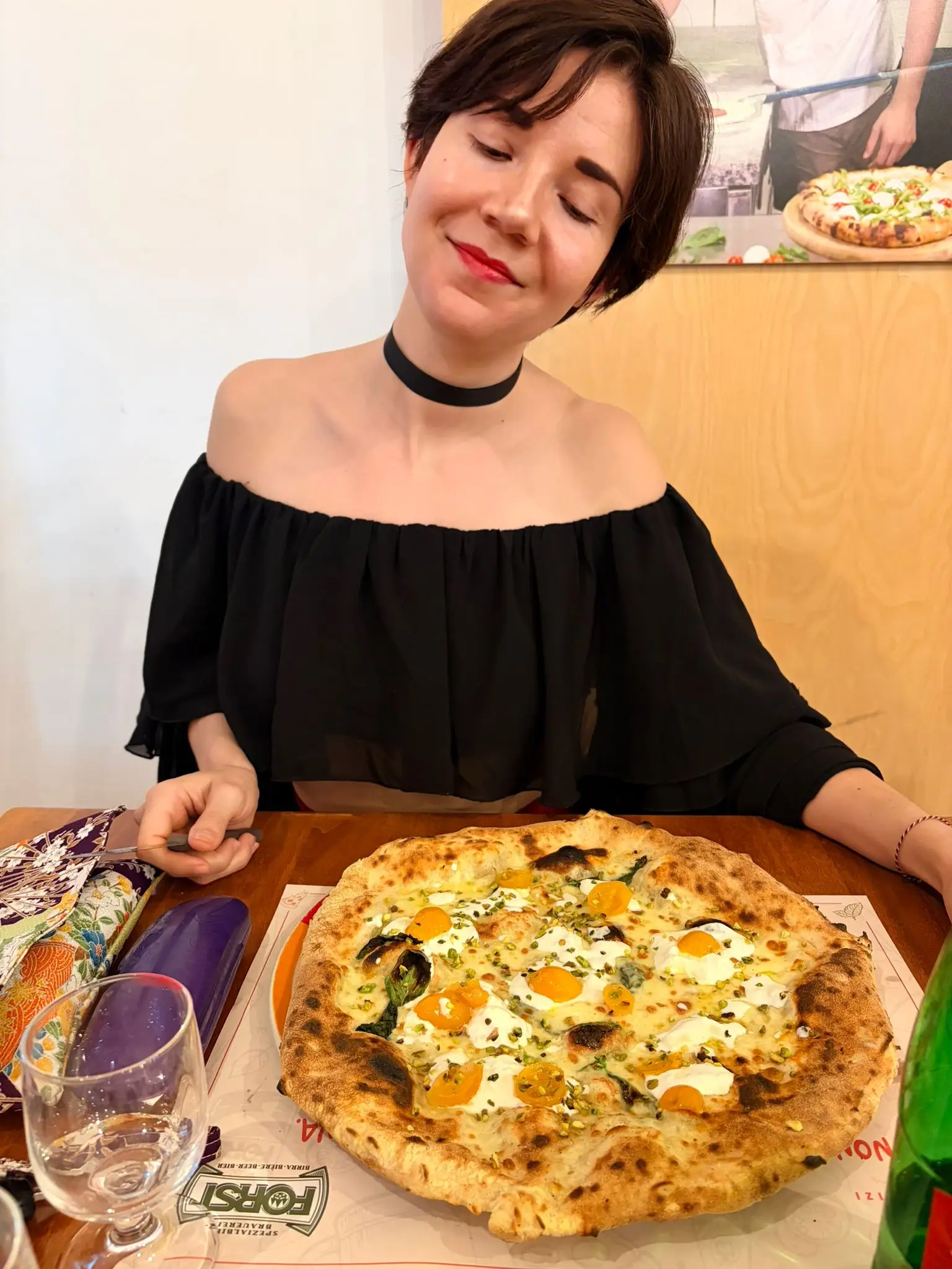 the author with her favorite pizza in Italy