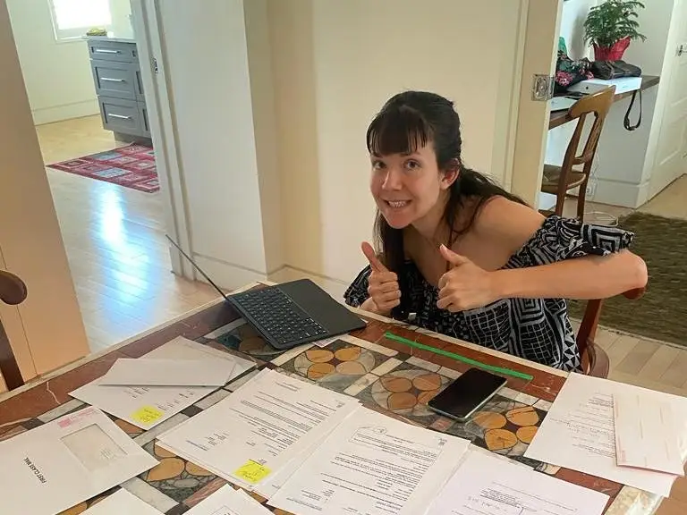 the author with her paperwork to immigrate to Belgium.