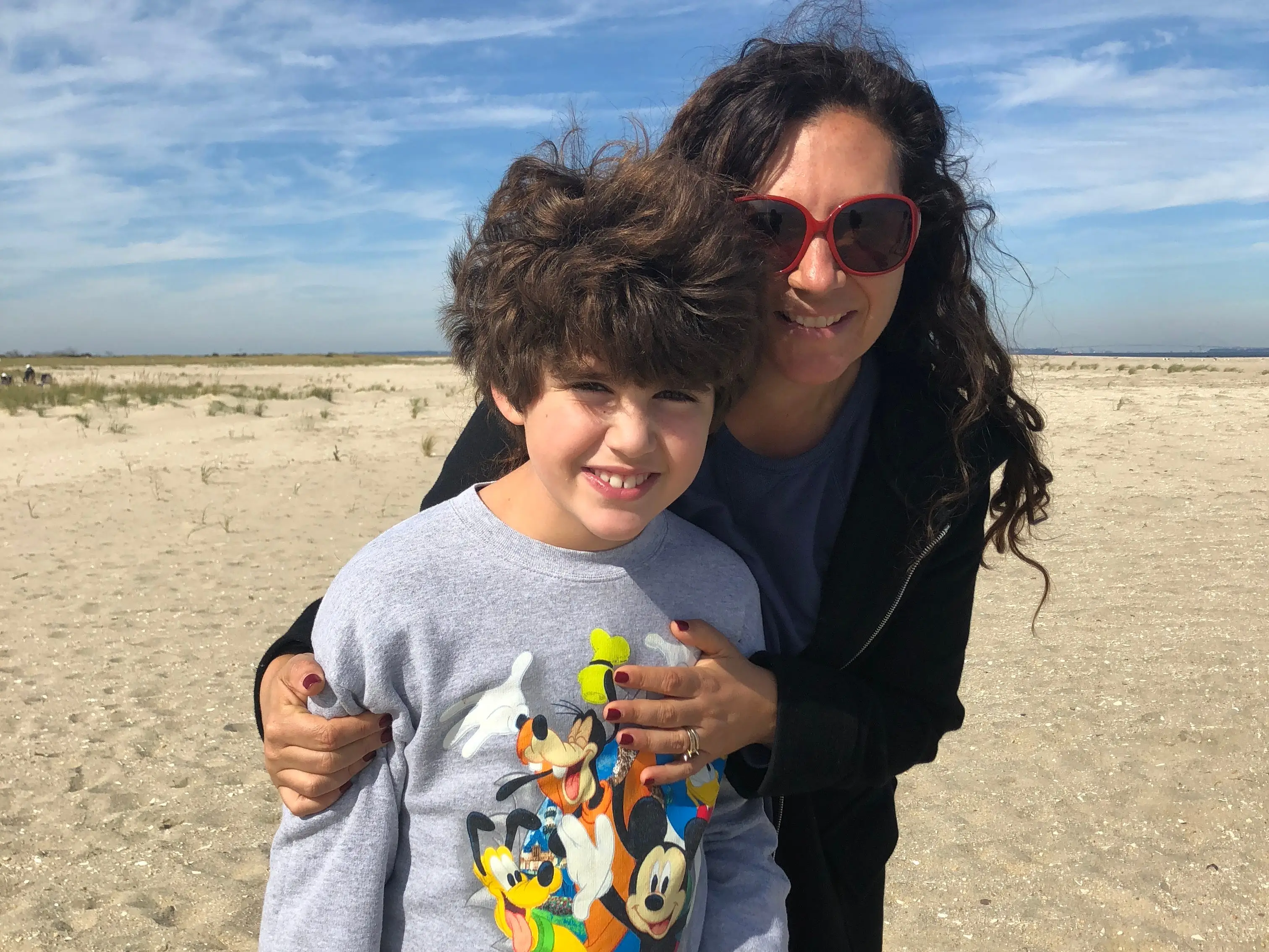 Woman posingwith her son outside
