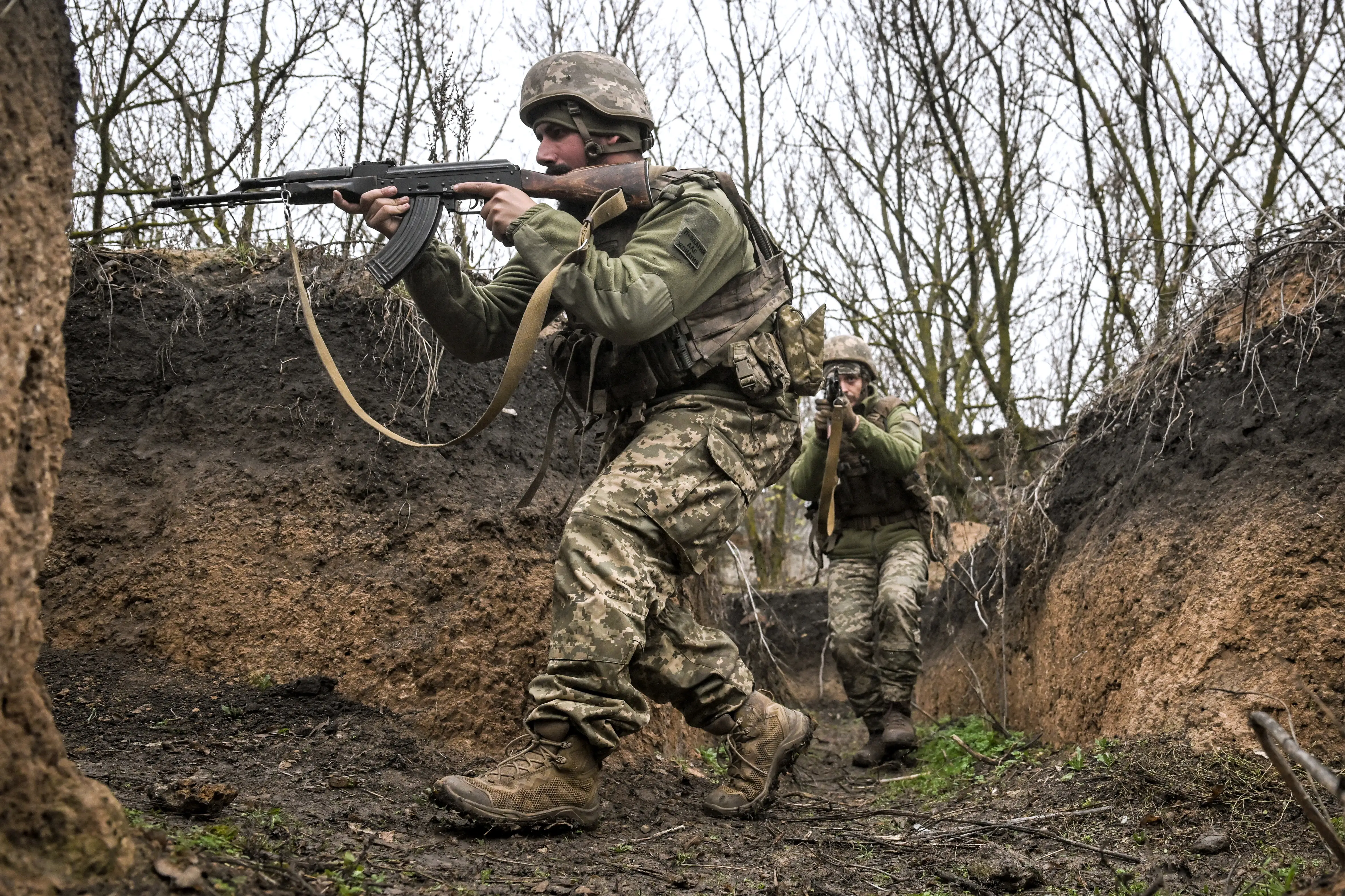 Soldiers from the 102nd Samar Wolves Battalion of Ukraine?s 108th Territorial Defence Brigade, armed with rifles, move in the trenches during shooting and tactical drills, Ukraine, November 10, 2025.