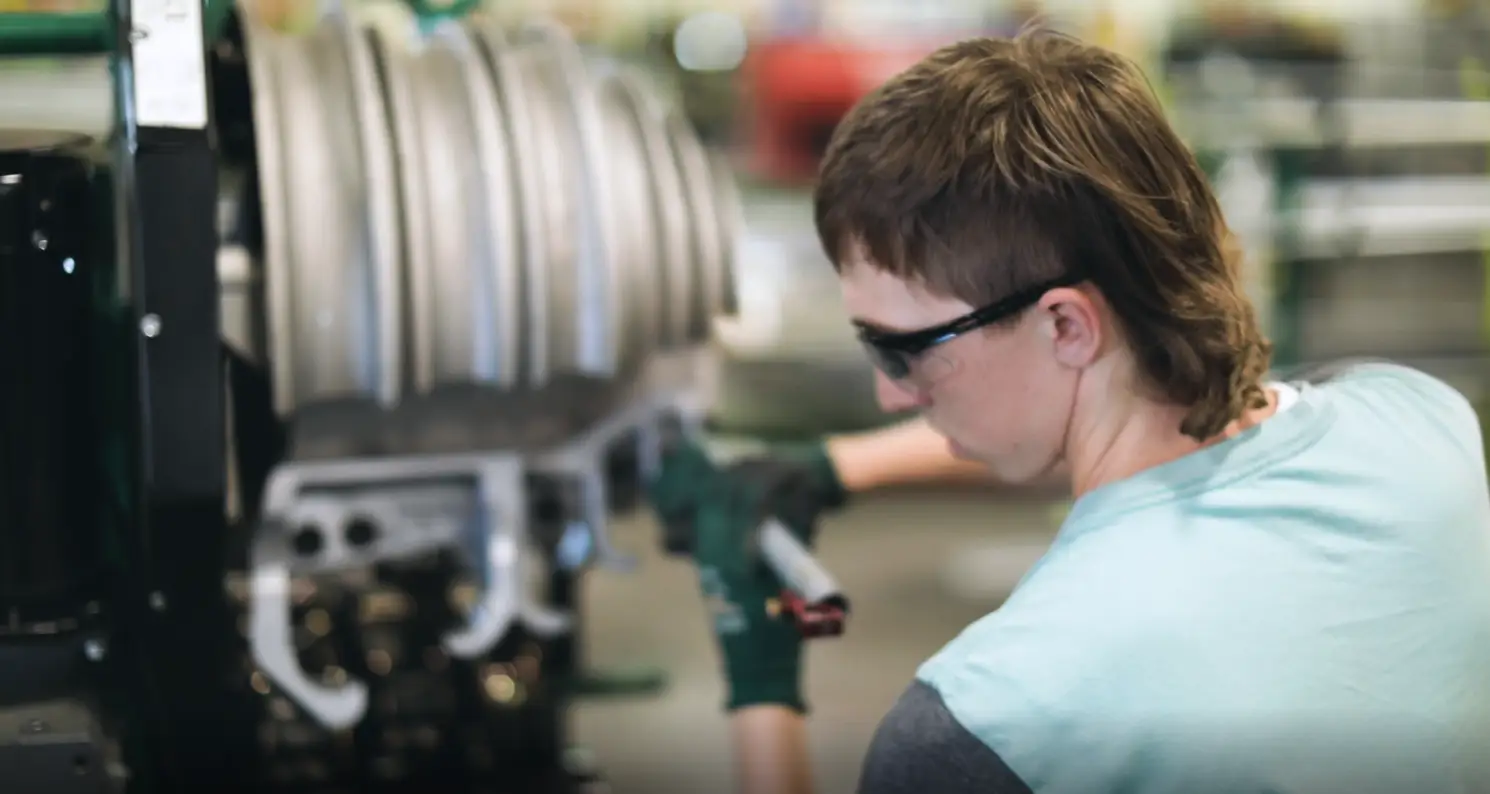 Cody Cole working on a machine