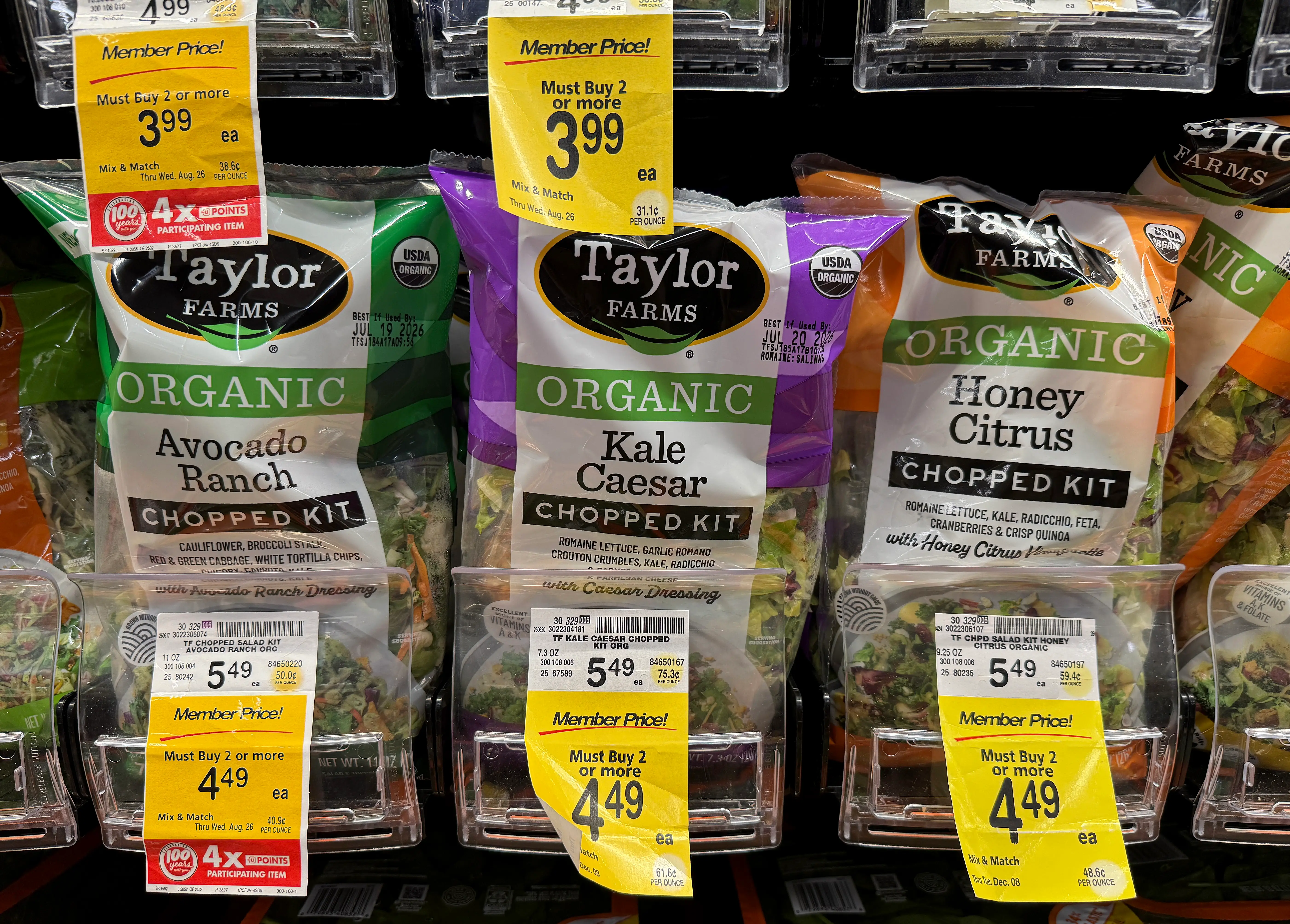 Packages of Taylor Farms salad greens are displayed at a Safeway store on July 16, 2026 in Kings Beach, California. Federal health officials are investigating whether shredded iceberg lettuce supplied by California-based Taylor Farms was the source of a nationwide Cyclospora outbreak that has sickened more than 1,600 people in 34 states, though no definitive link has been confirmed.