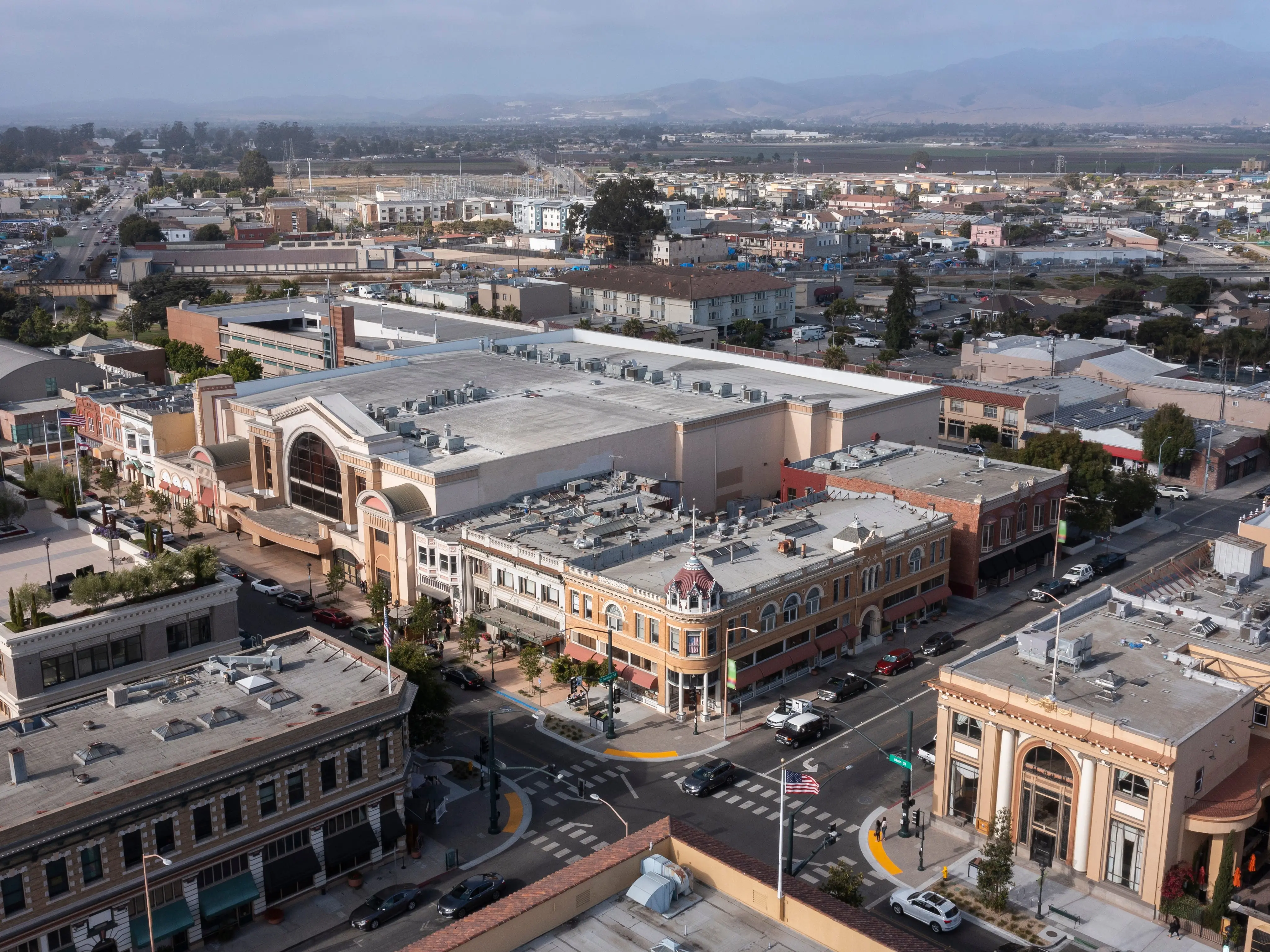 During a break in the fog, afternoon sunlight shines on the historic city center of downtown Salinas, California, USA.