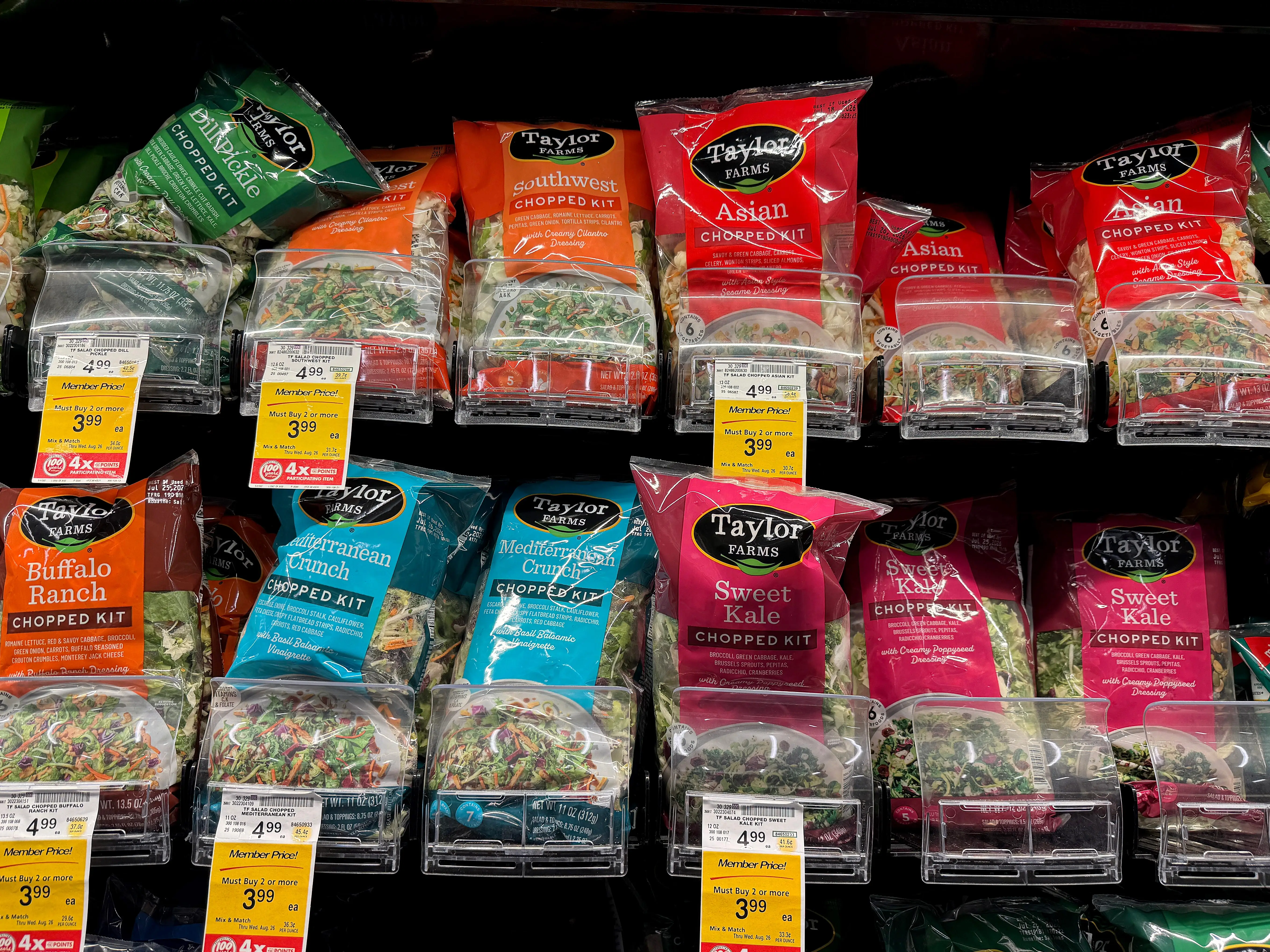 Packages of Taylor Farms salad greens are displayed at a Safeway store on July 16, 2026 in Kings Beach, California. Federal health officials are investigating whether shredded iceberg lettuce supplied by California-based Taylor Farms was the source of a nationwide Cyclospora outbreak that has sickened more than 1,600 people in 34 states, though no definitive link has been confirmed.