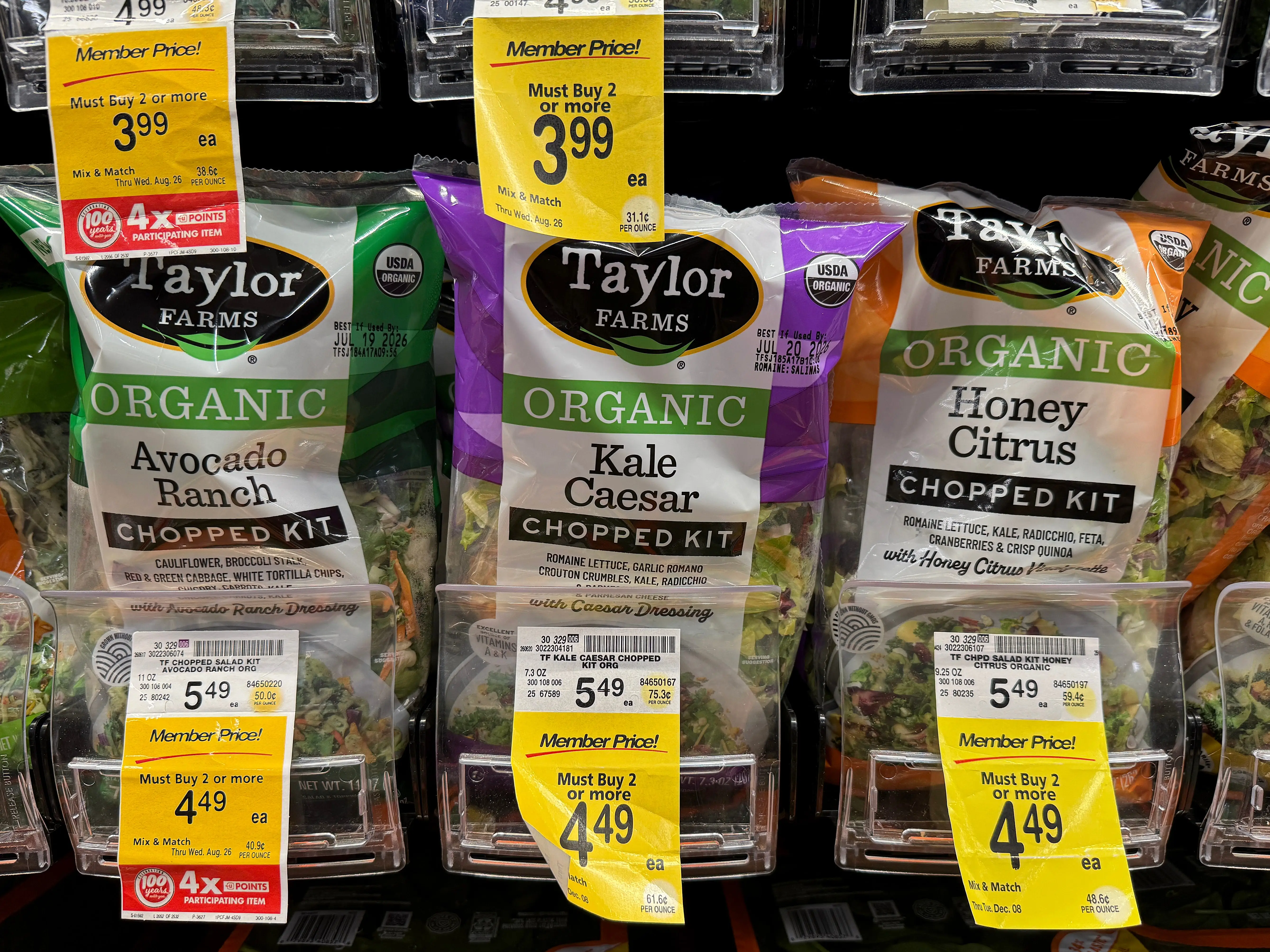 Packages of Taylor Farms salad greens are displayed at a Safeway store on July 16, 2026 in Kings Beach, California. Federal health officials are investigating whether shredded iceberg lettuce supplied by California-based Taylor Farms was the source of a nationwide Cyclospora outbreak that has sickened more than 1,600 people in 34 states, though no definitive link has been confirmed.