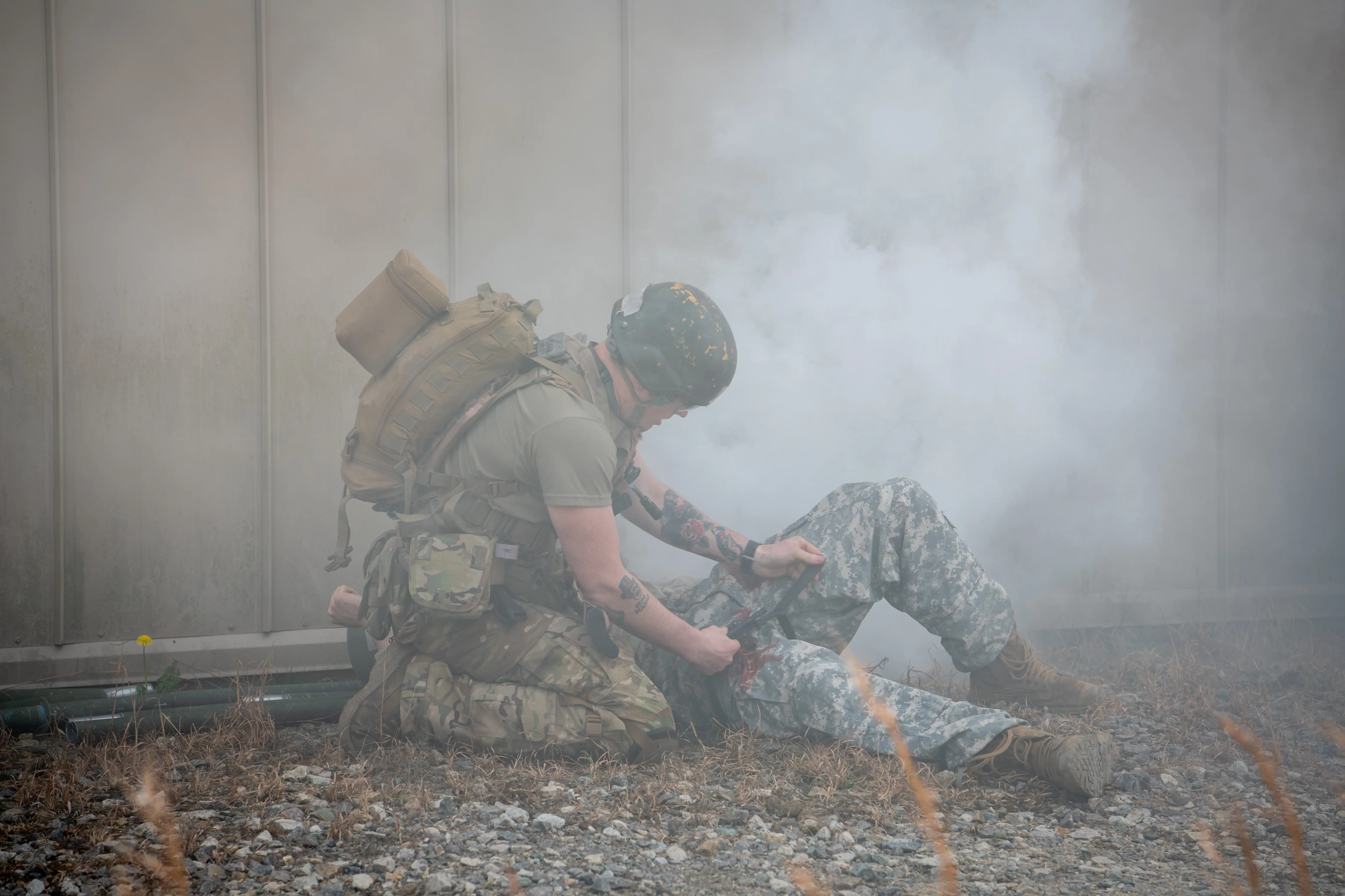 A student at the Special Operations Combat Medic Course and School applies a tourniquet to a simulated wound during a casualty scenario at Fort Bragg, North Carolina Feb. 16, 2023.