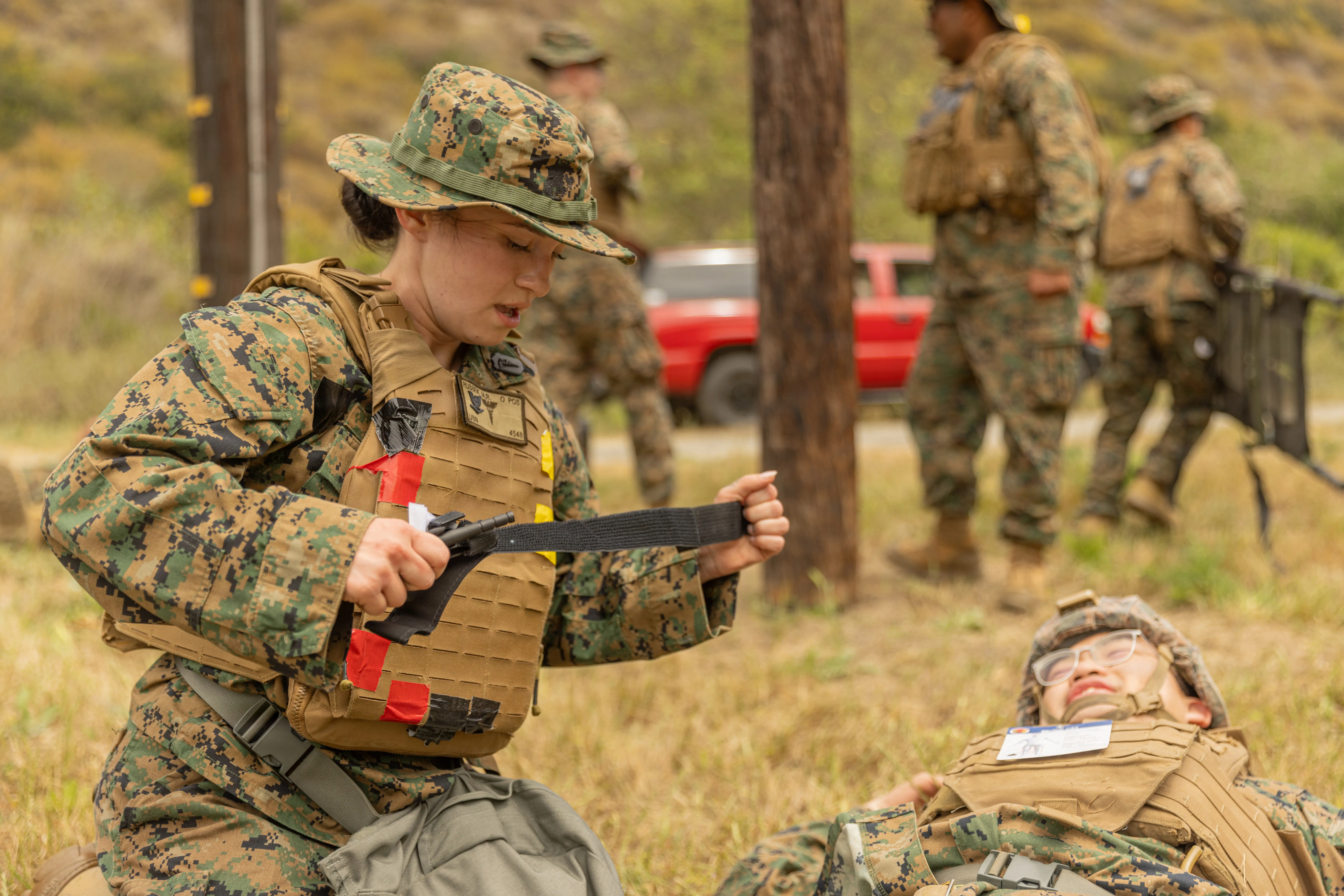 A Navy dental provider prepares to apply a tourniquet during a training exercise at Marine Corps Base Camp Pendleton, California, April 21, 2026.