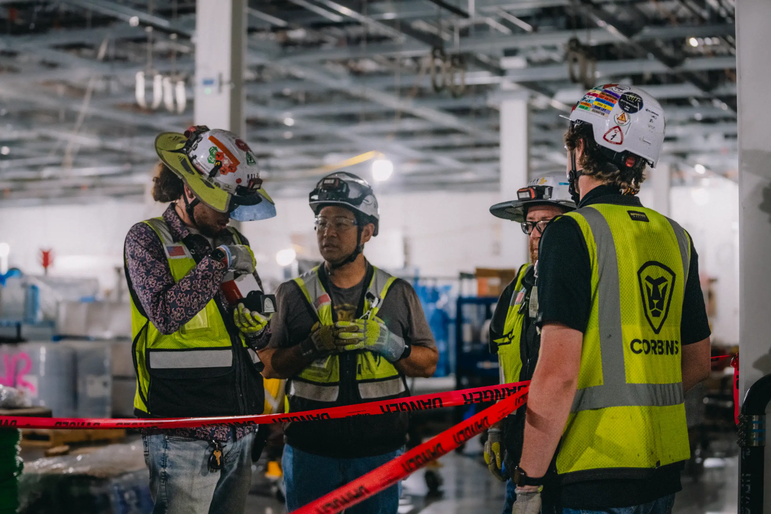 Four Corbins employees gather in a group