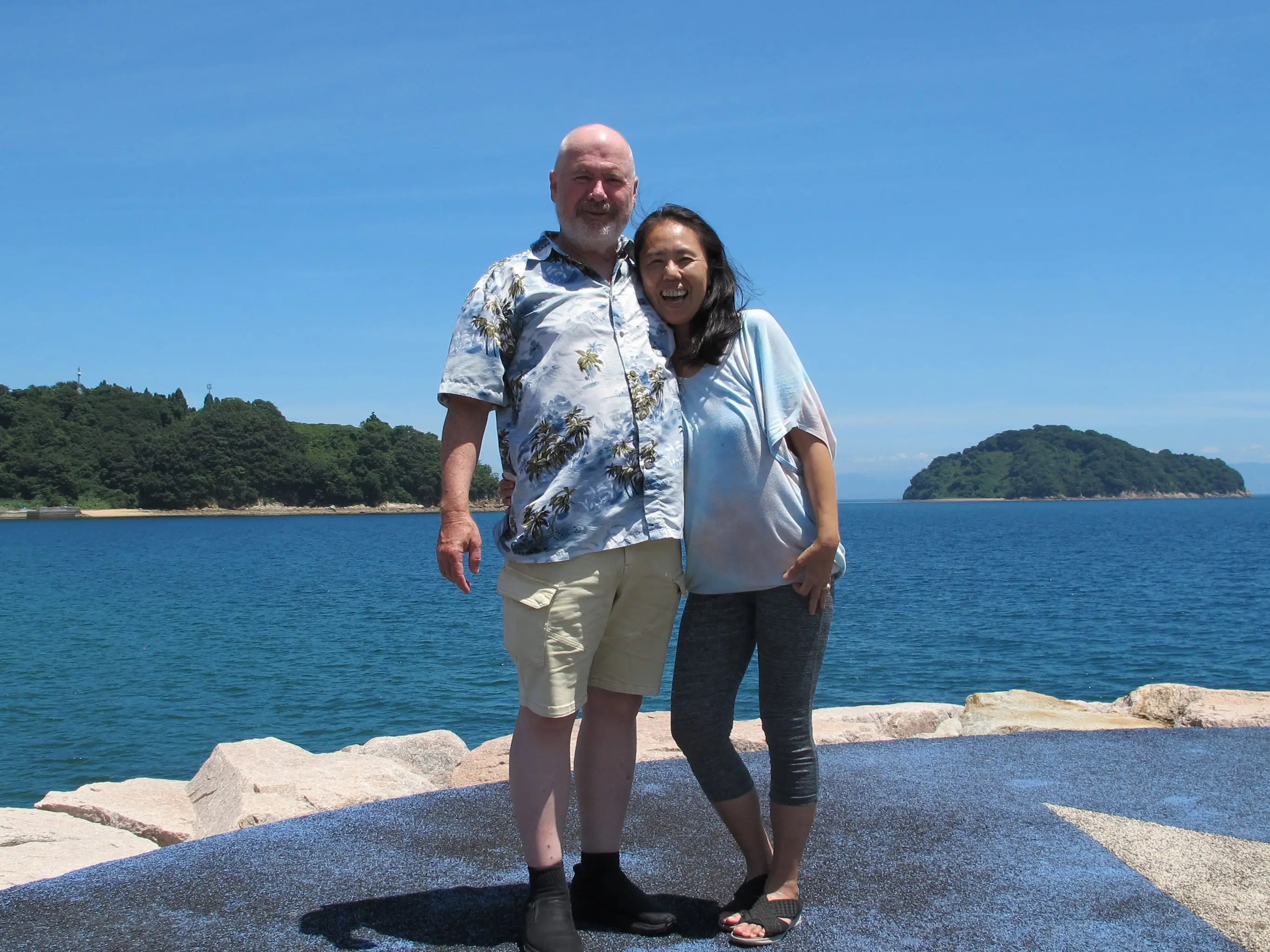 A couple posing by the ocean on Suo-Oshima island.