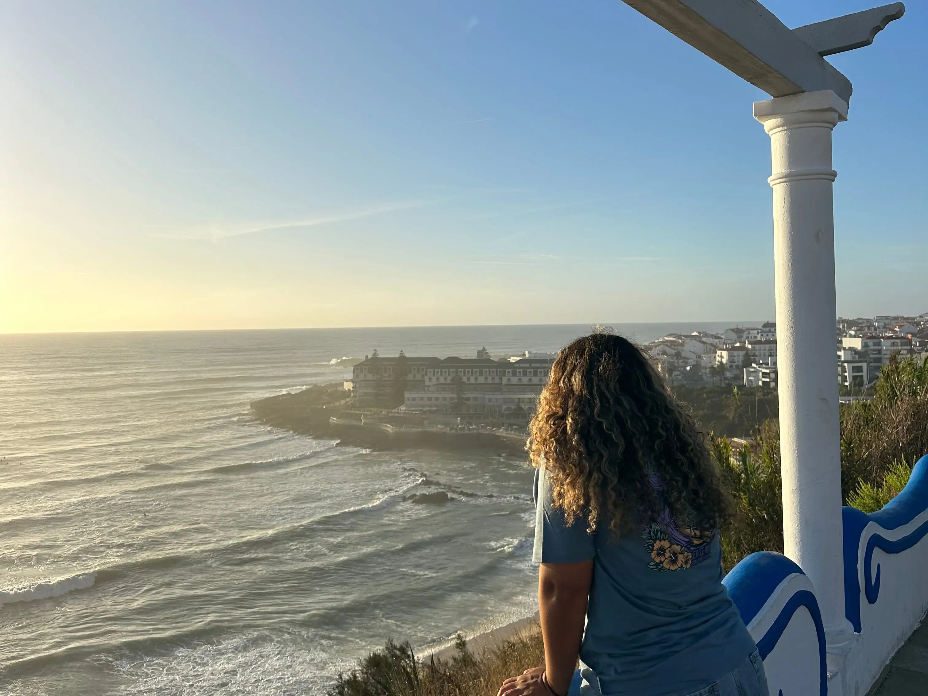 The writer gazing out at the water in Lisbon.