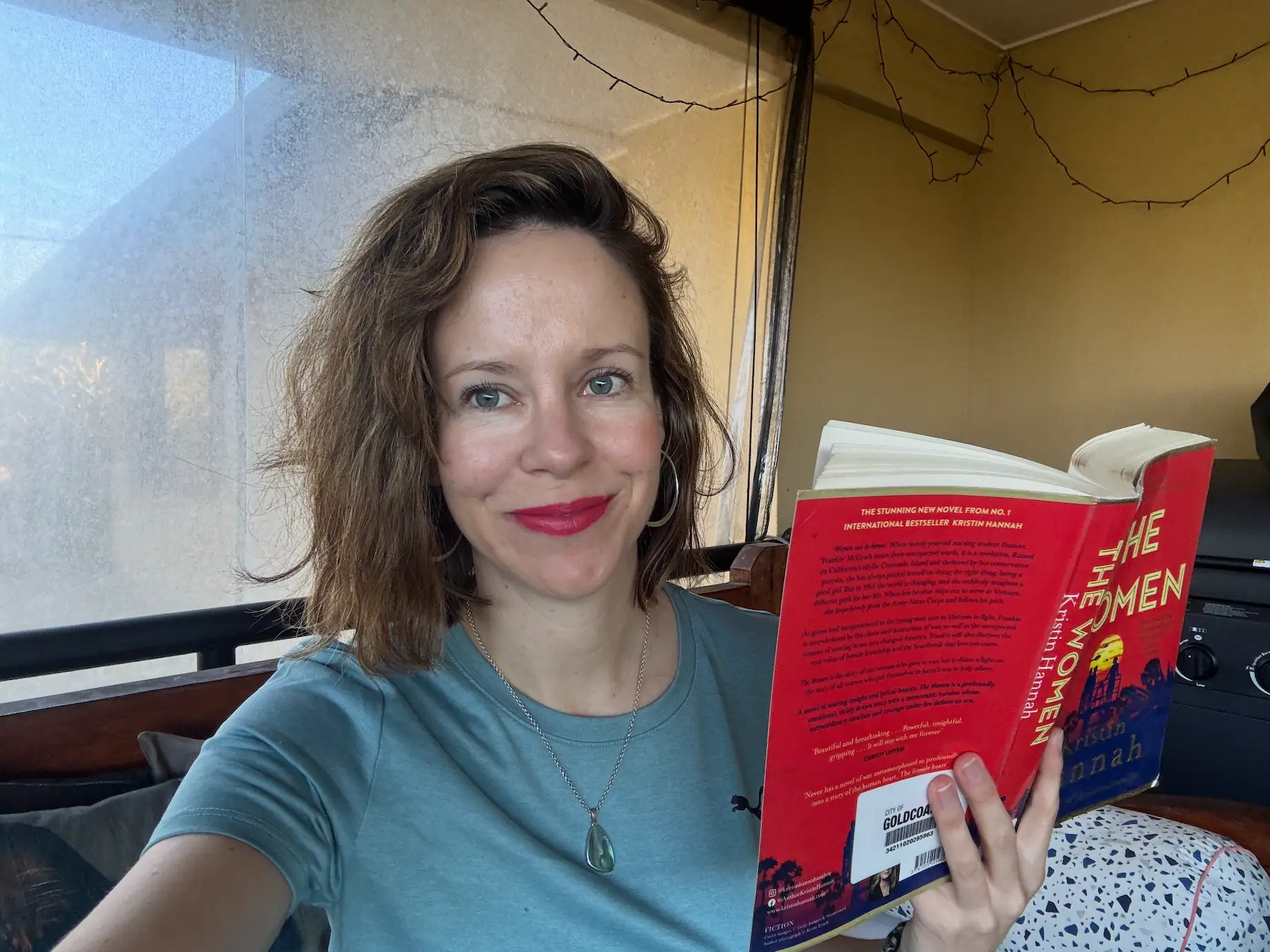 The author reading the book 'The Women.'