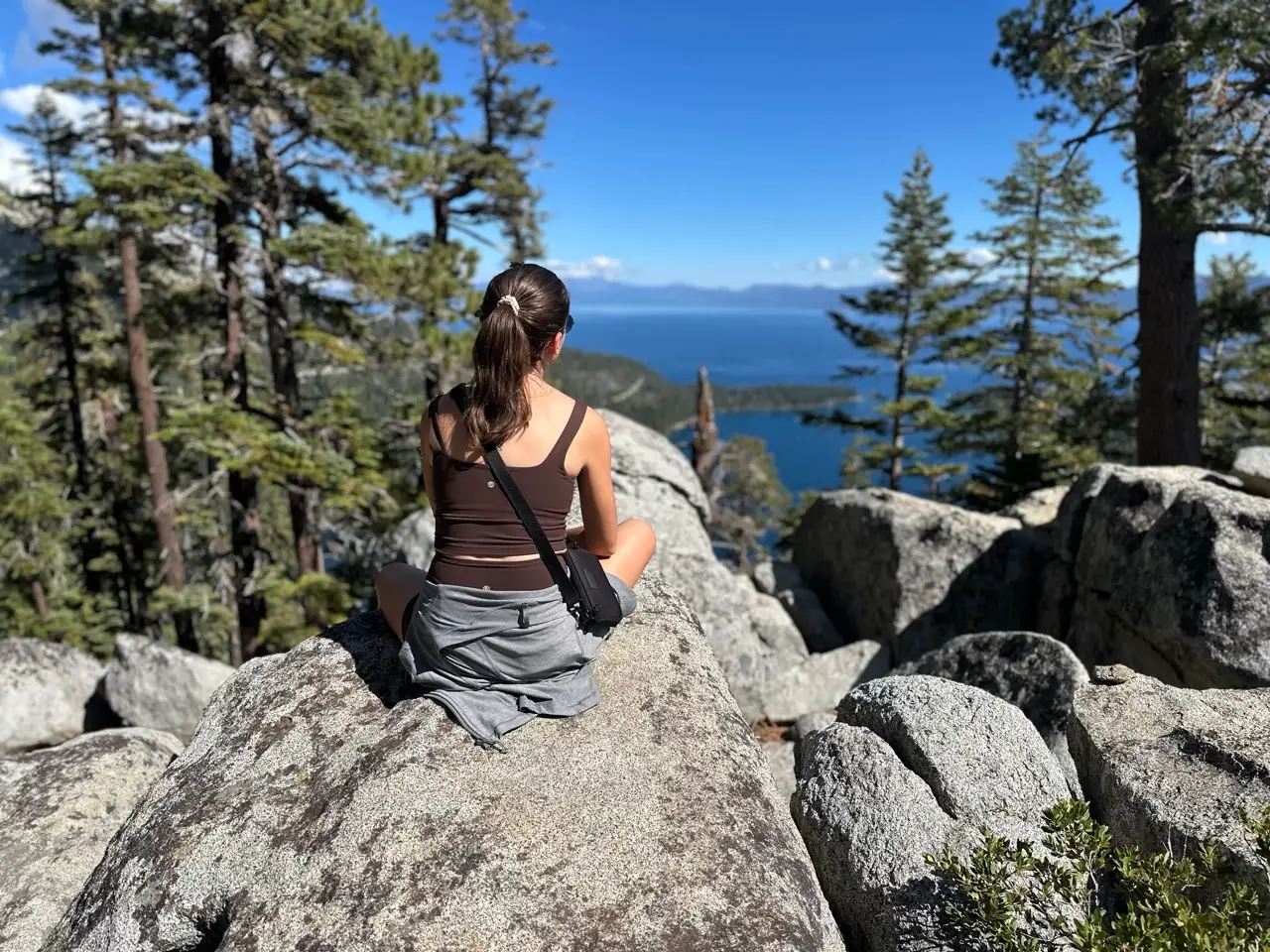 Woman sitting on rock overlooking Eagle Lake