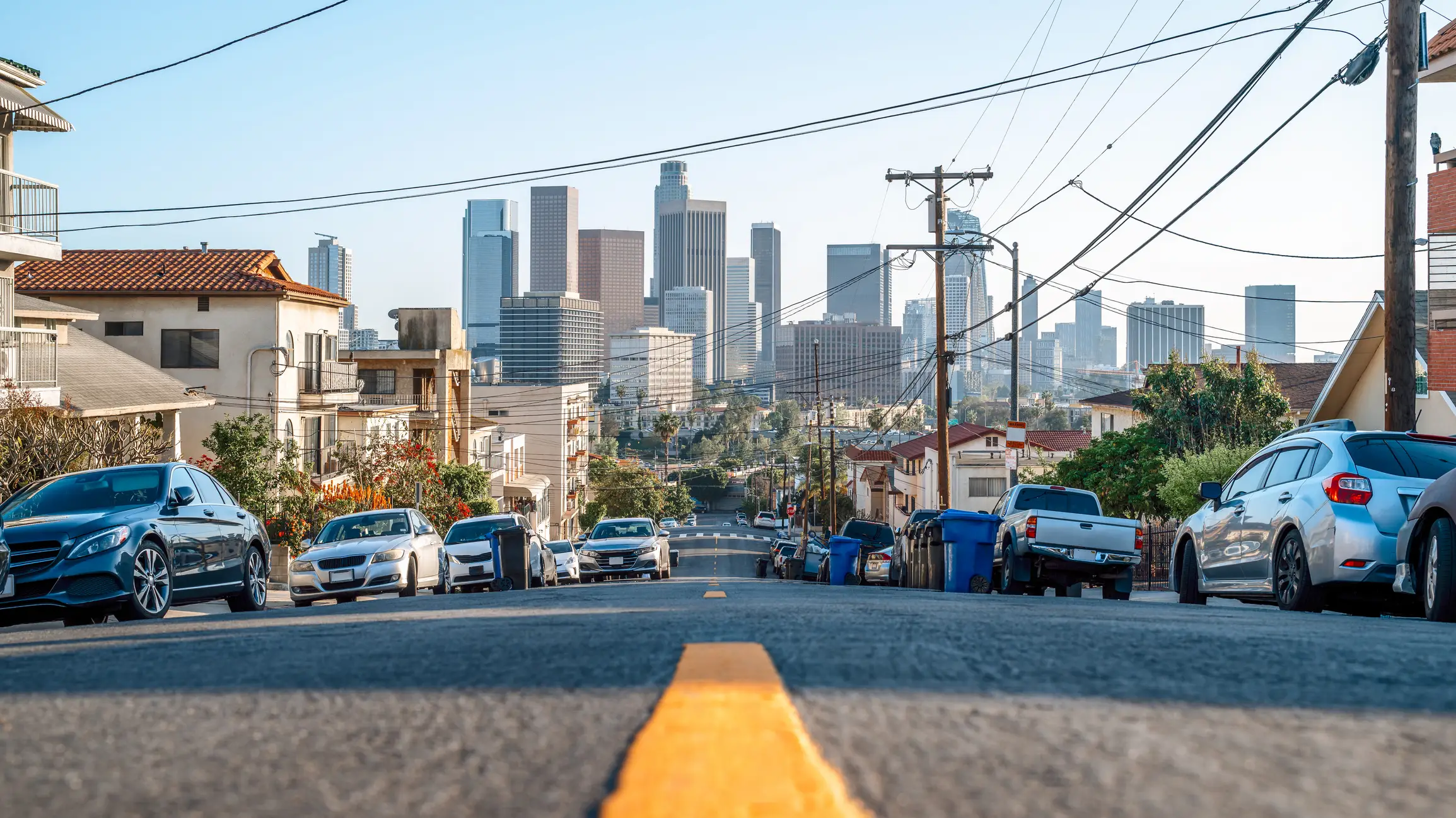 View of cars, buildings from road in California
