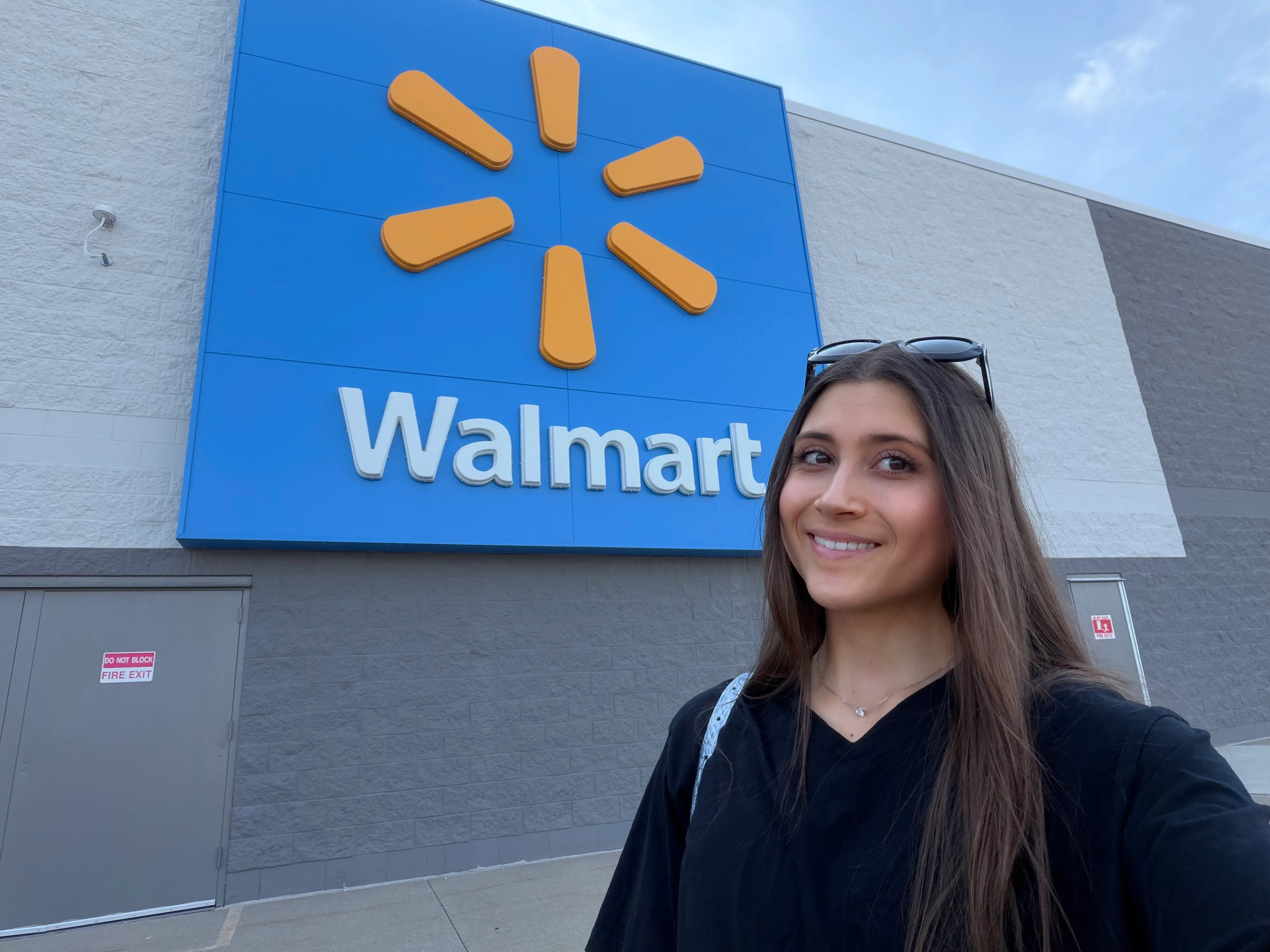 Author smiling outside of Walmart