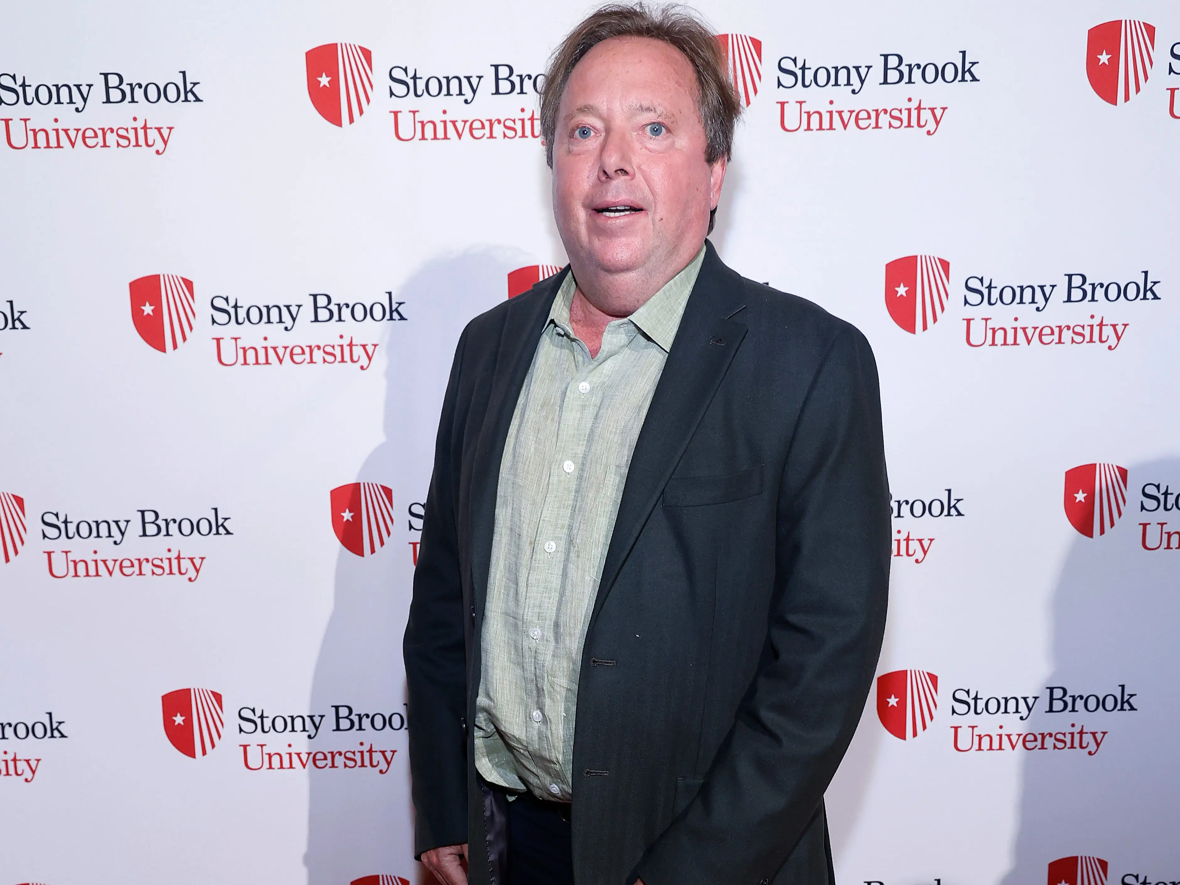 Rich Gelfond in a dark suit jacket