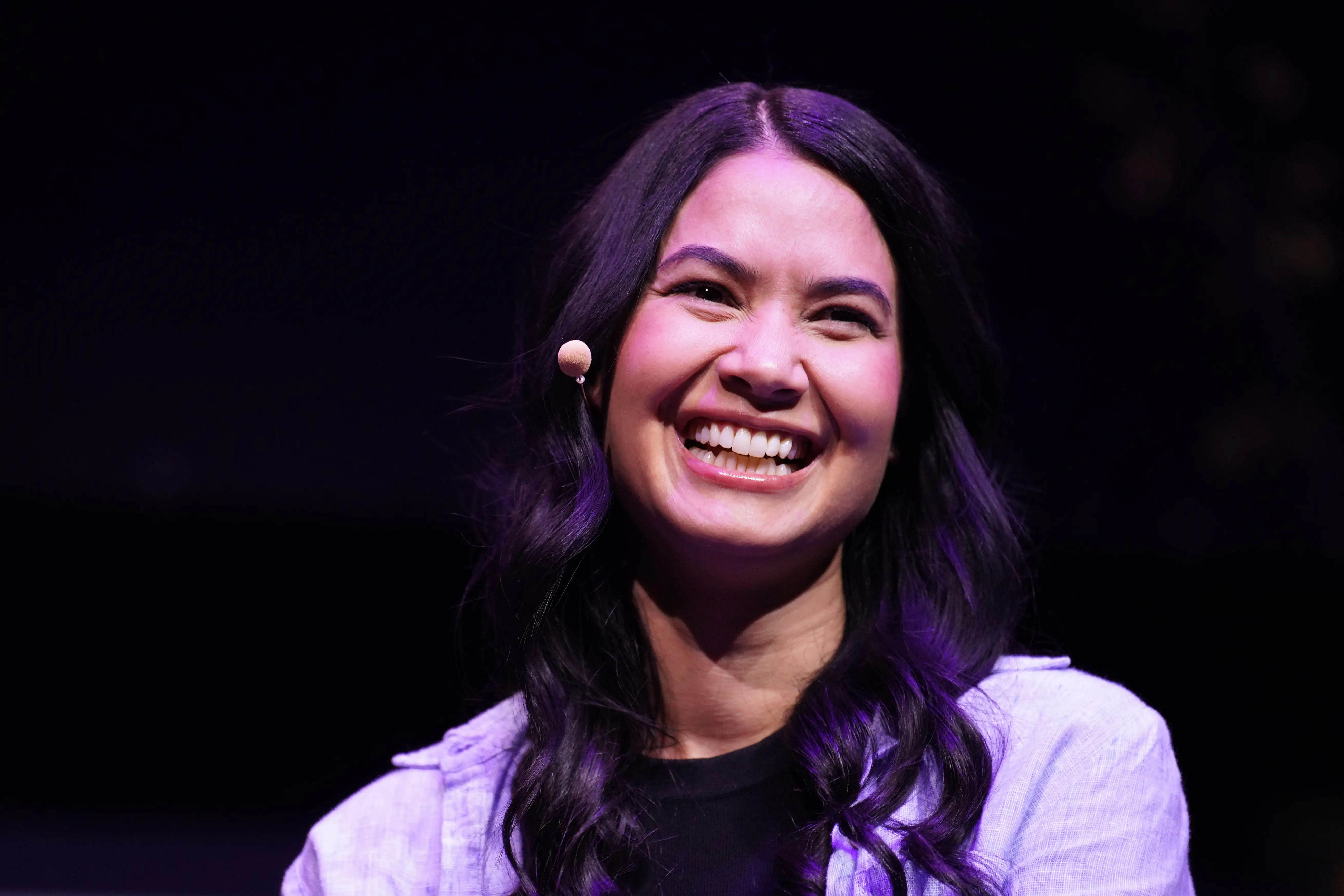 Canva CEO Melanie Perkins laughs during the SXSW Key Note conversation with General Partner at BOND Mary Meeker.