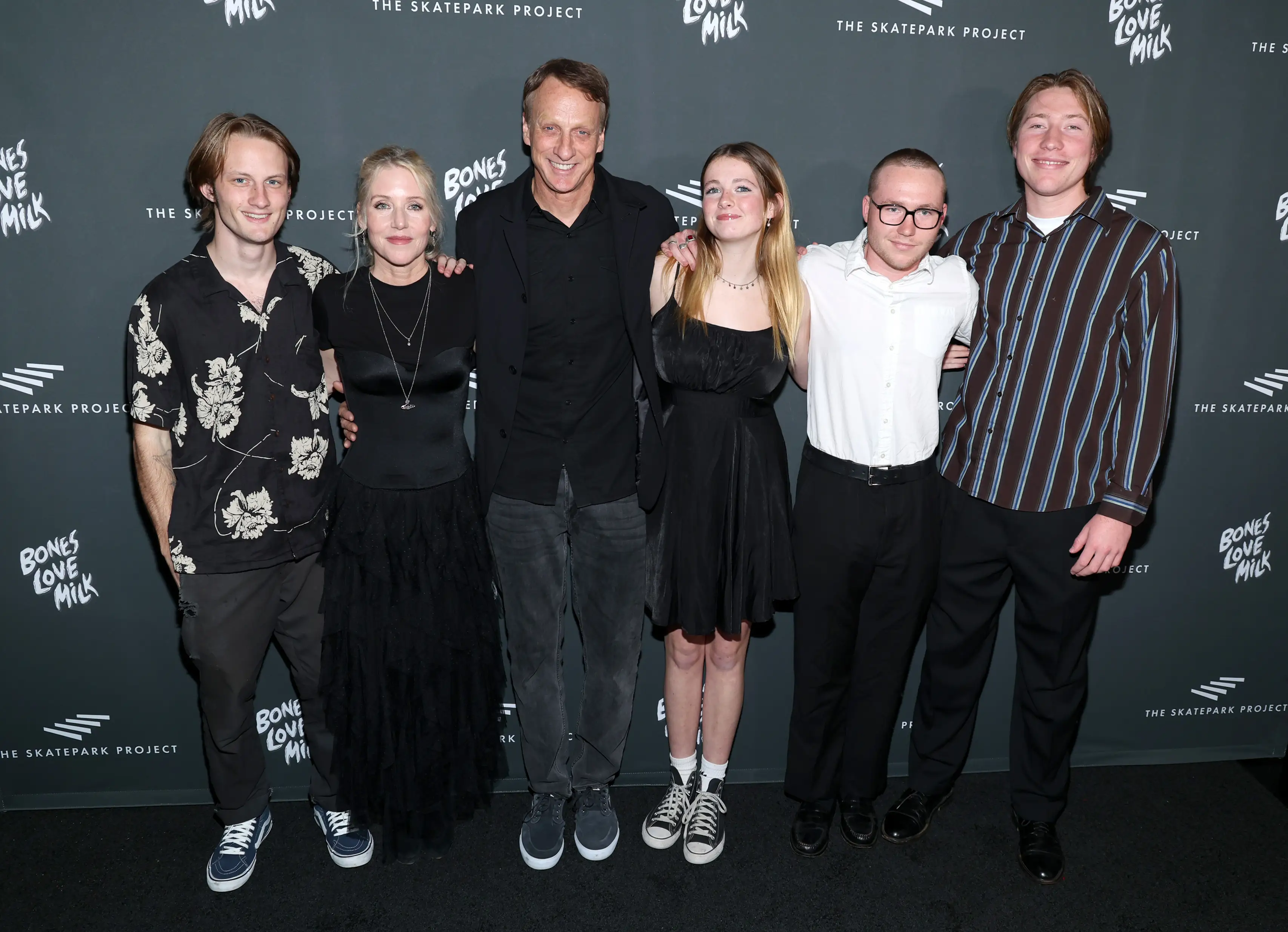 (L-R) Keegan Hawk, Catherine Goodman, Tony Hawk, Kadence Hawk, Miles Goodman and Calvin Goodman attend The Skatepark Project Gala at Chateau Marmont on November 17, 2023 in Los Angeles, California.