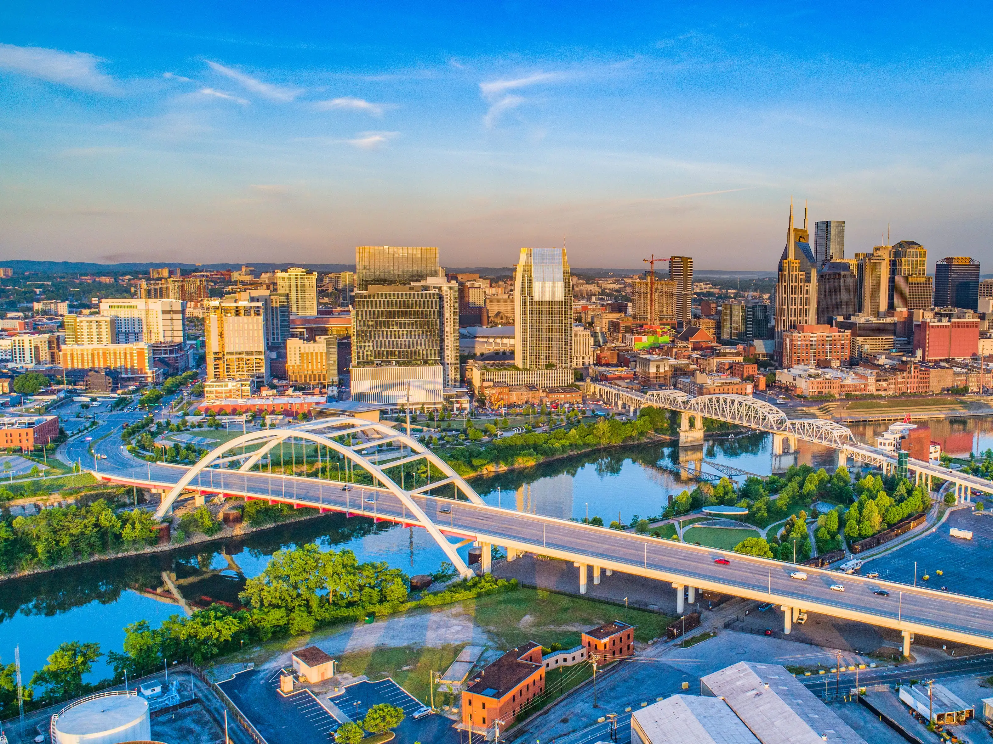 Bridges in front of Nashville, Tennessee, skyline.