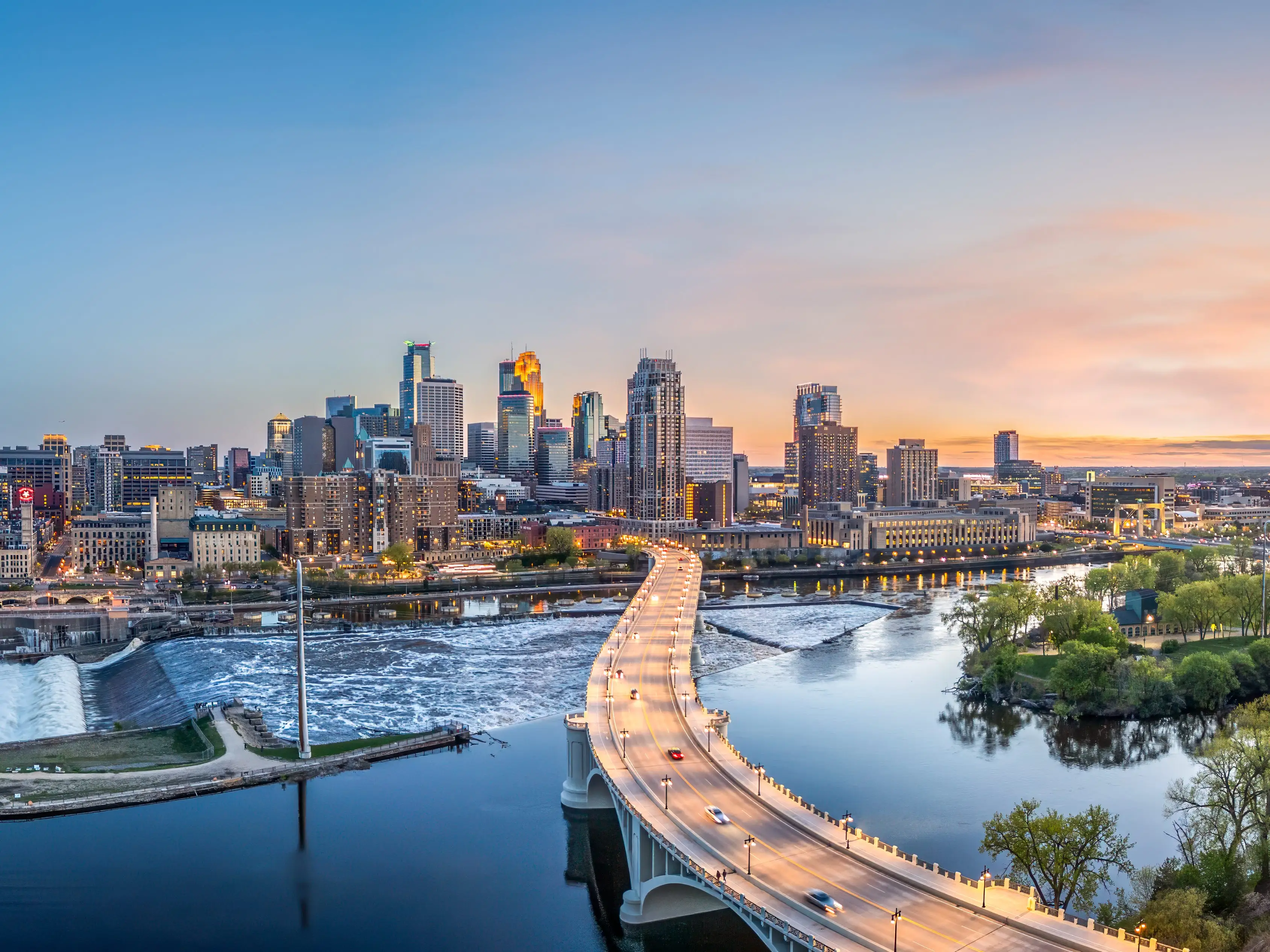 Bridge over water leading to buildings in Minneapolis, Minnesota.