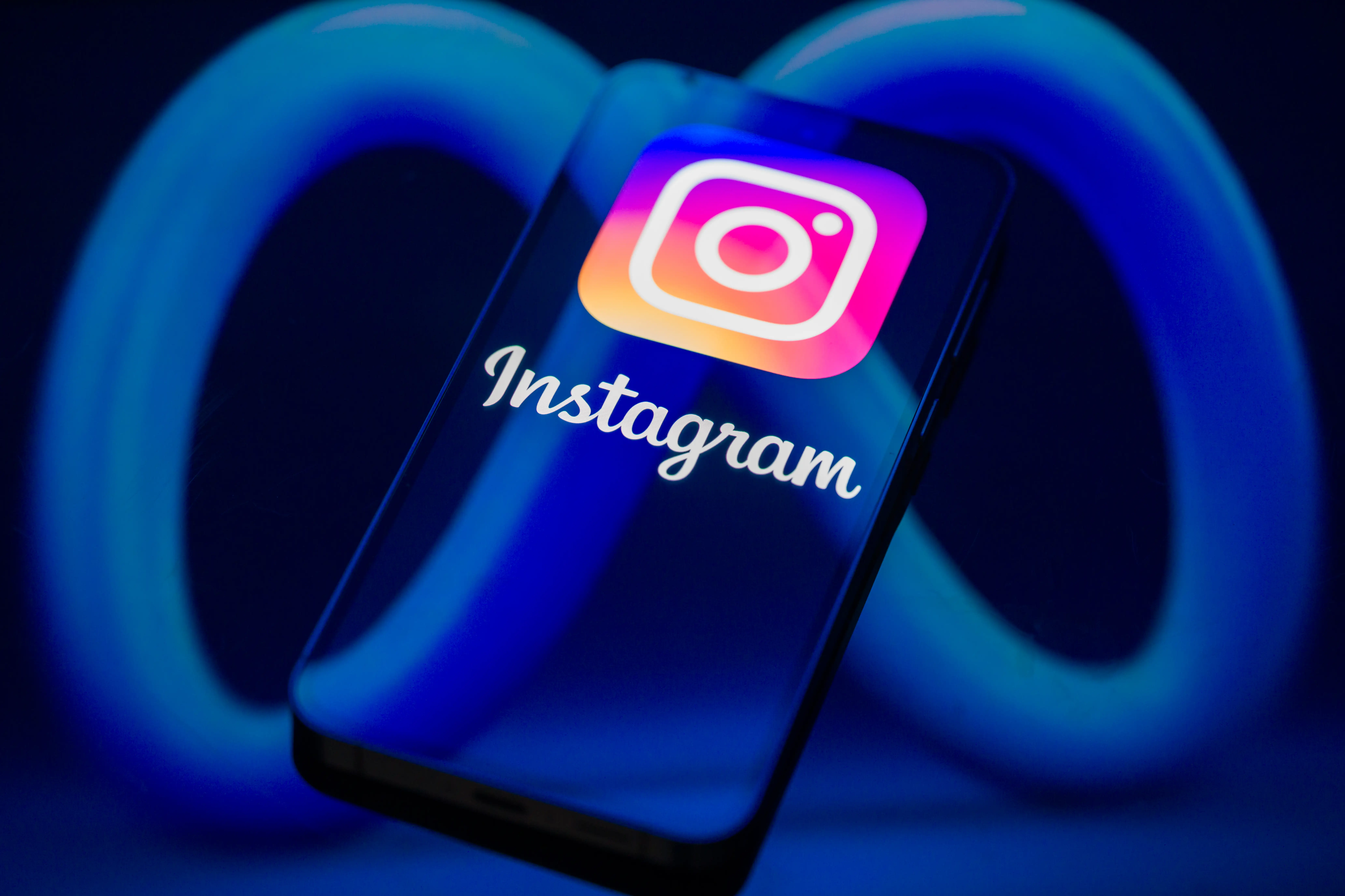 The Instagram logo is displayed on a smartphone screen in this photo illustration in Brussels, Belgium, on March 29, 2026. Governments, parents, and regulators are advocating for stricter safeguards to protect children online following lawsuits and investigations into social media addiction, exposure to harmful content, and risks to minors'