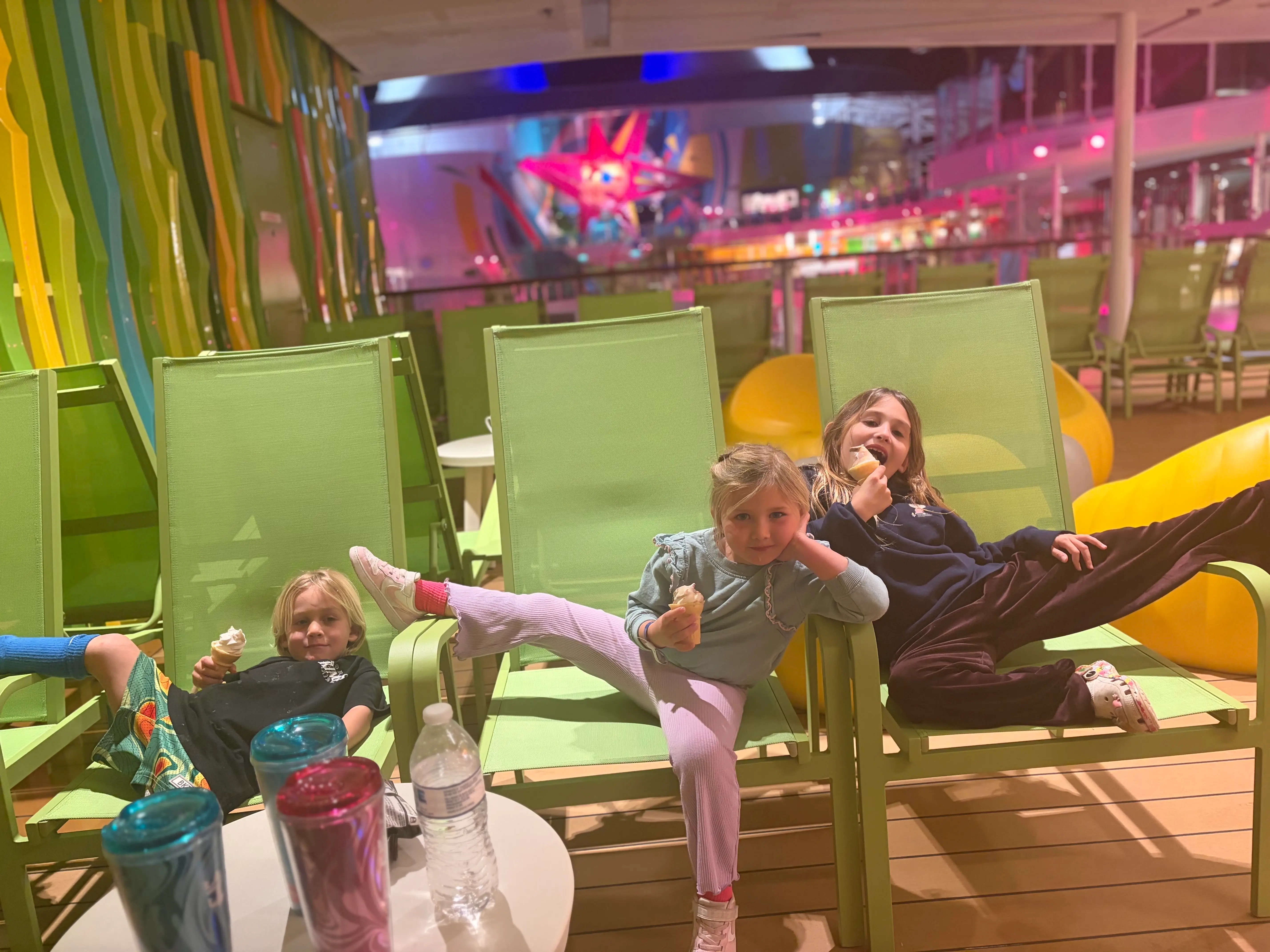 3 kids enjoy some late-night ice cream on a cruise ship.