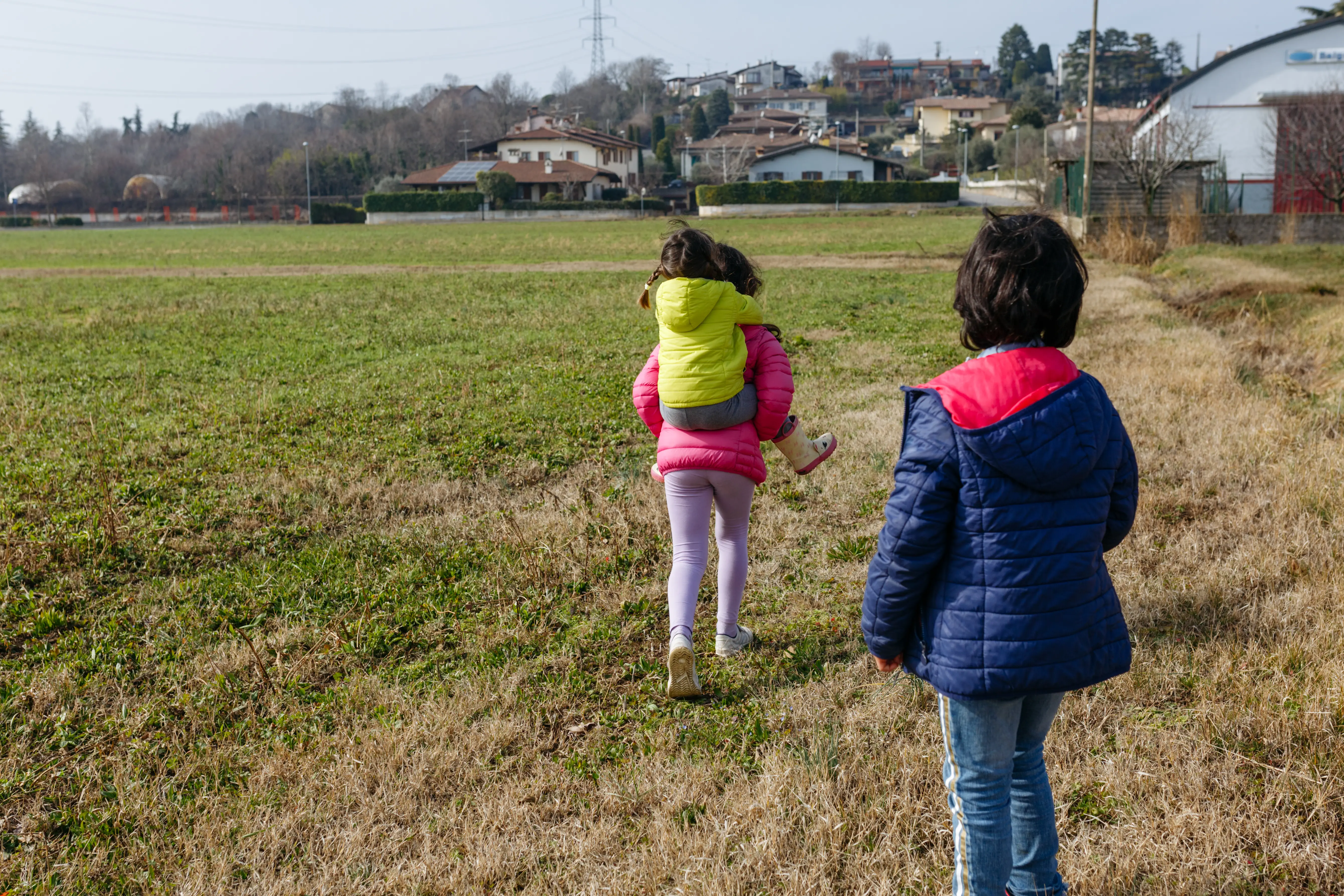 kids in puffer coats outside