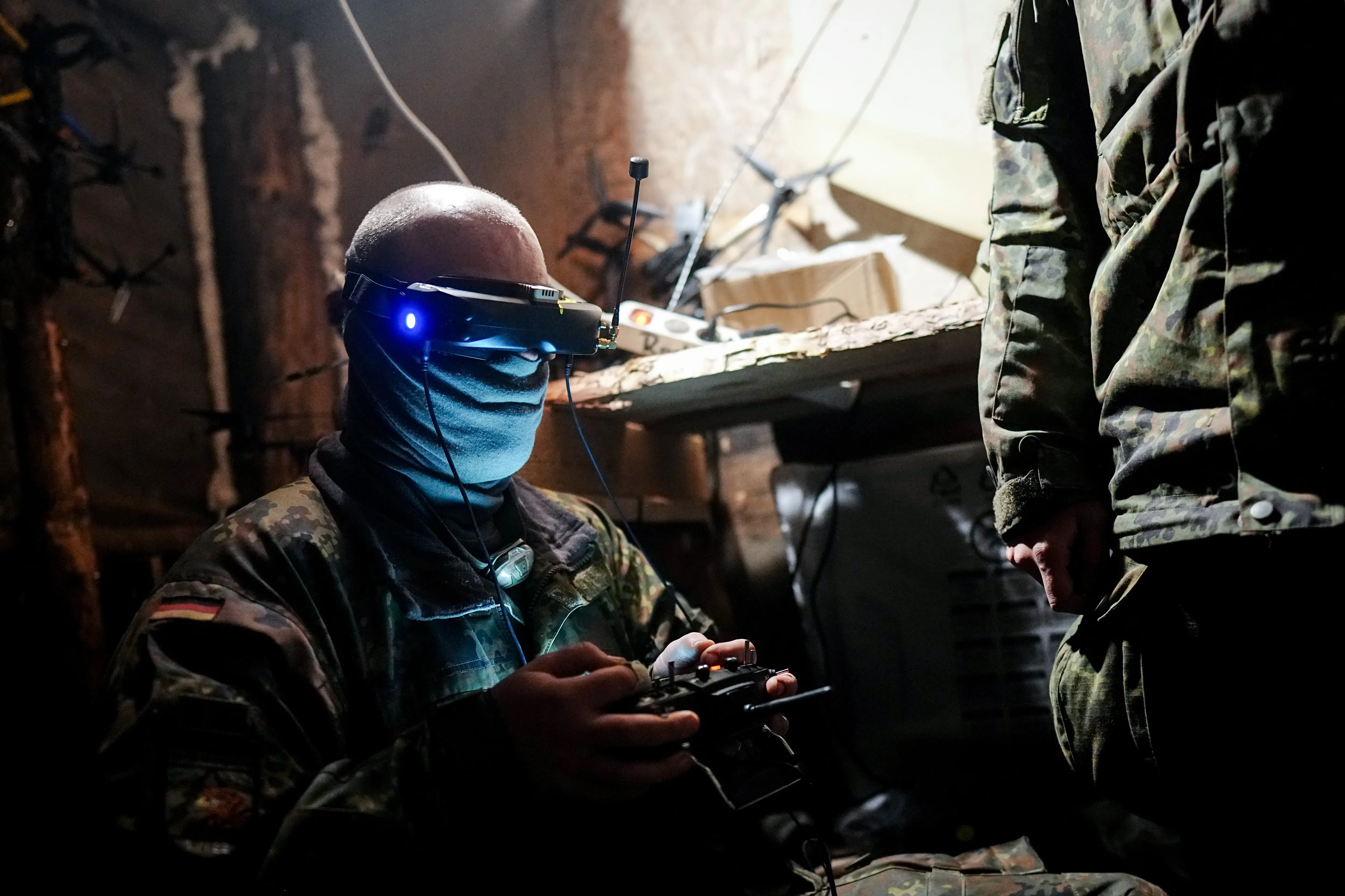 A drone pilot sits in an underground drone command post during the 
