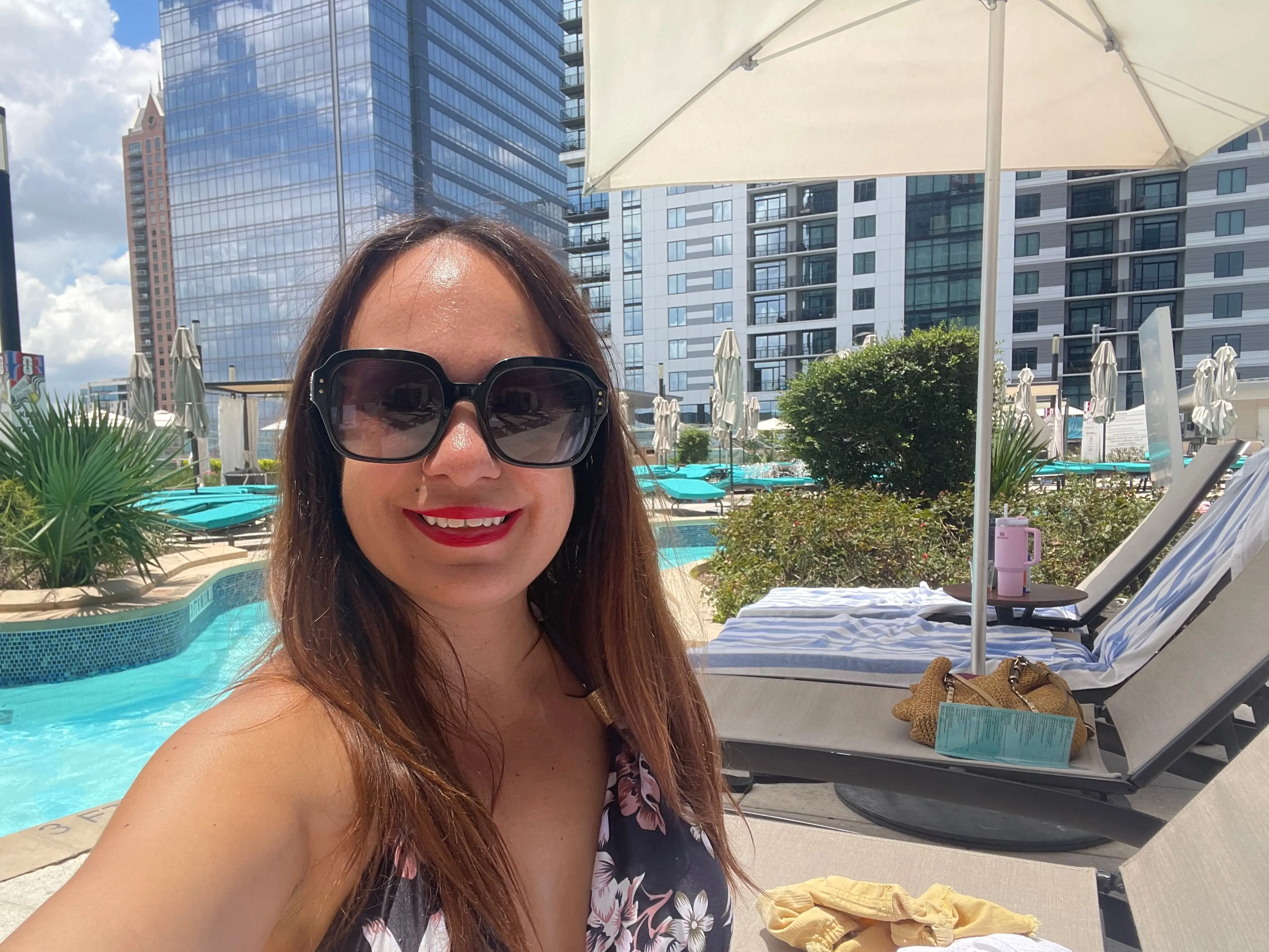 The author poses at a rooftop pool in Houston.