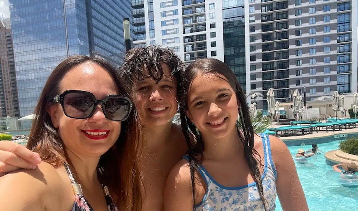 The author and her children at a rooftop pool.