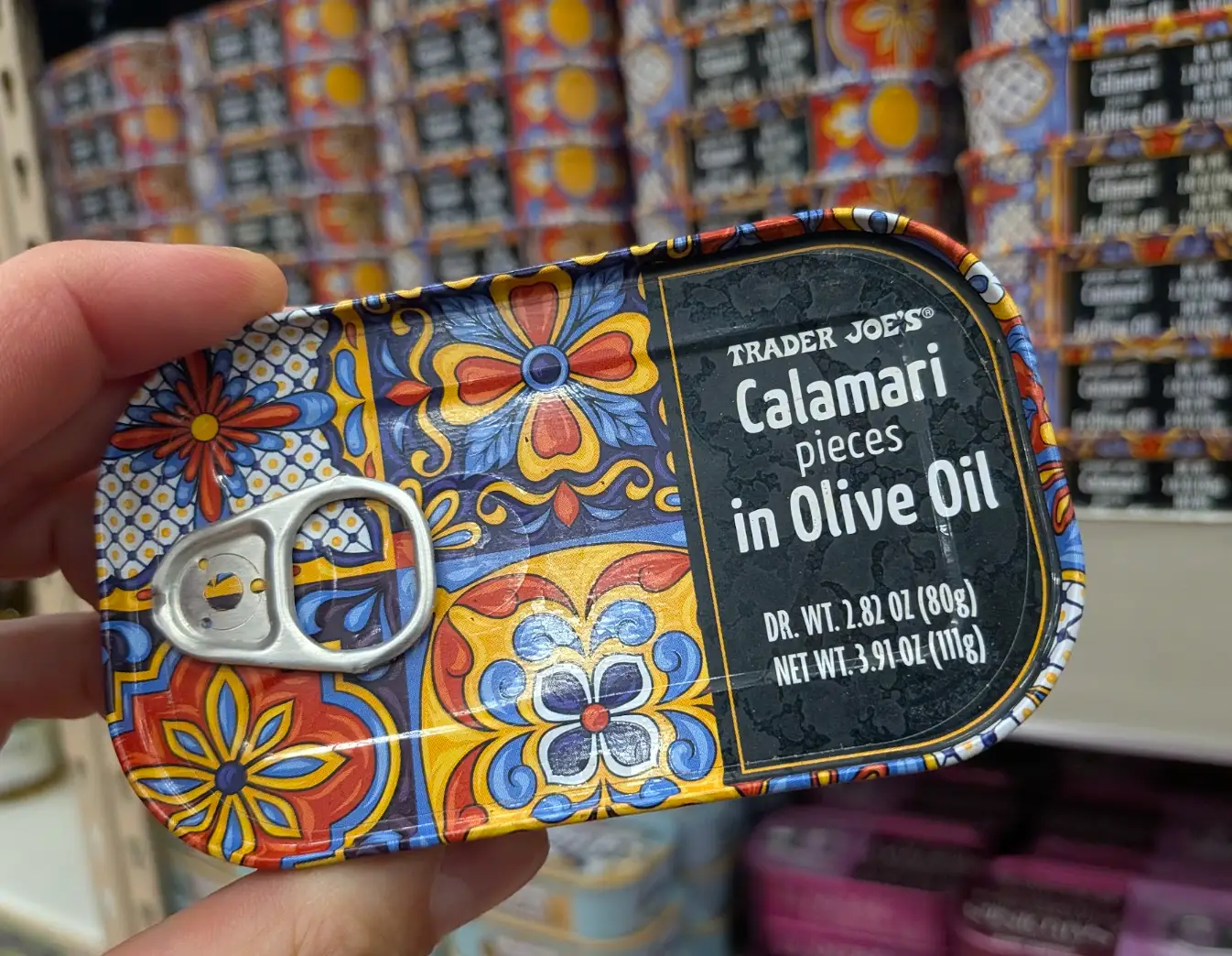 Trader Joe's calamari pieces in olive oil.