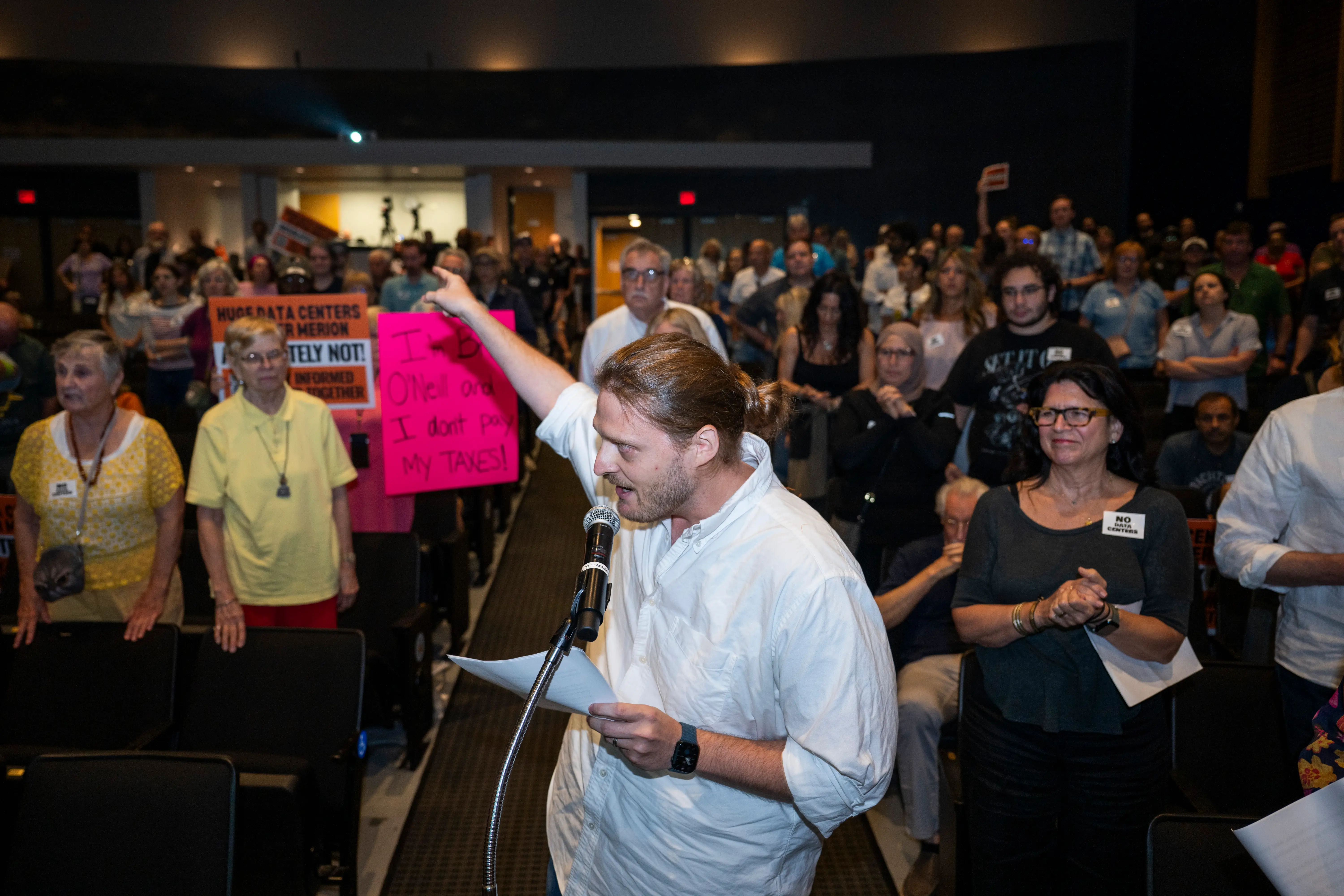 Residents speak during a meeting to discuss a proposed AI data center