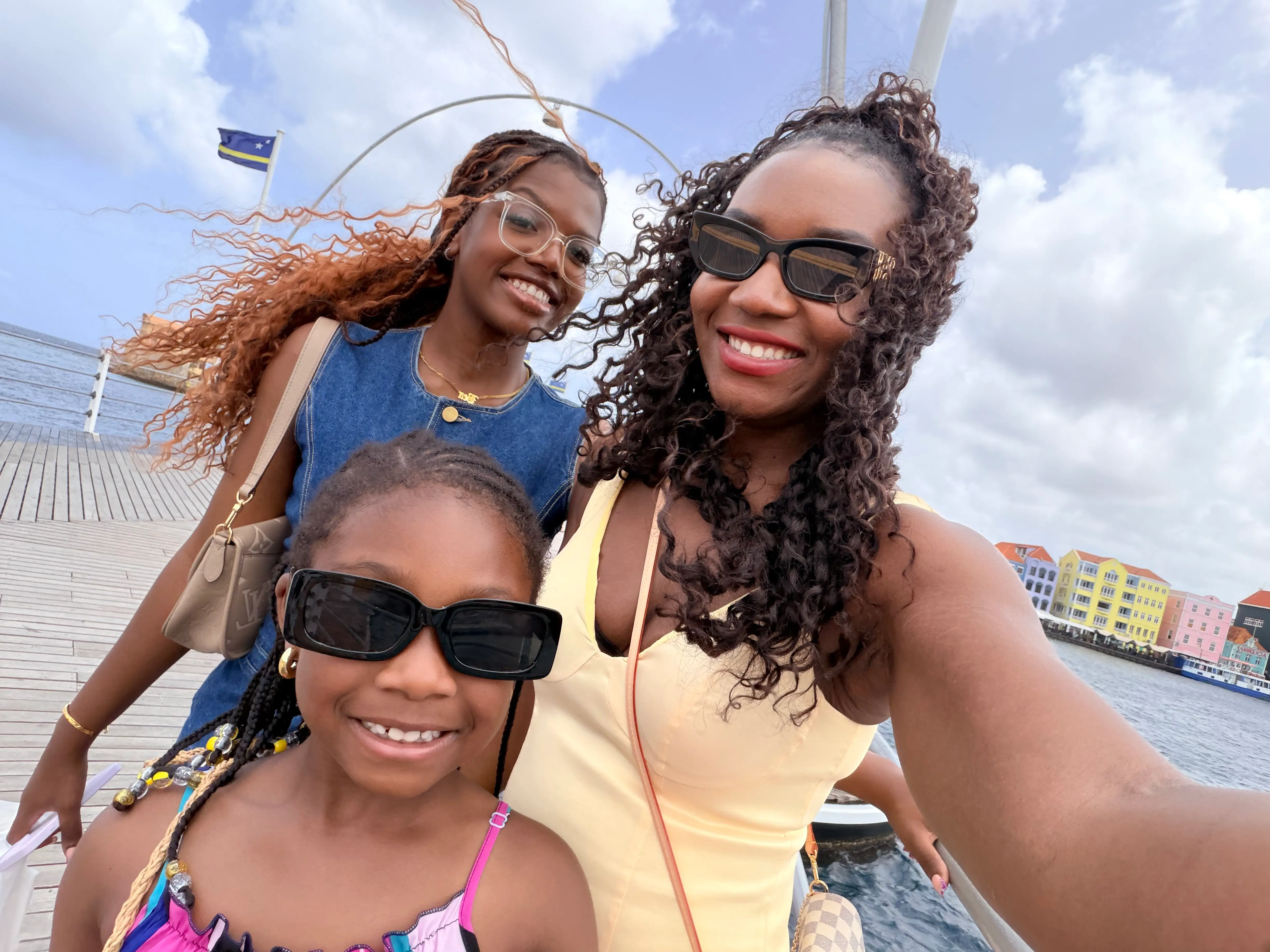 The writer posing for a selfie with her older sister and her niece.