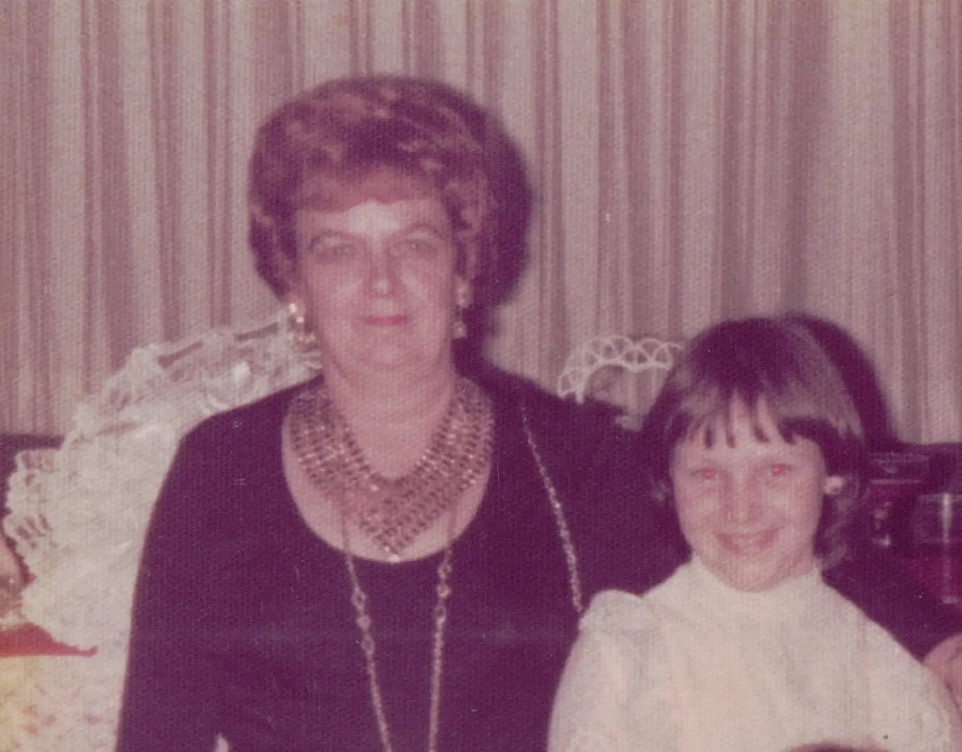 The author, as a young girl, poses with her grandmother.