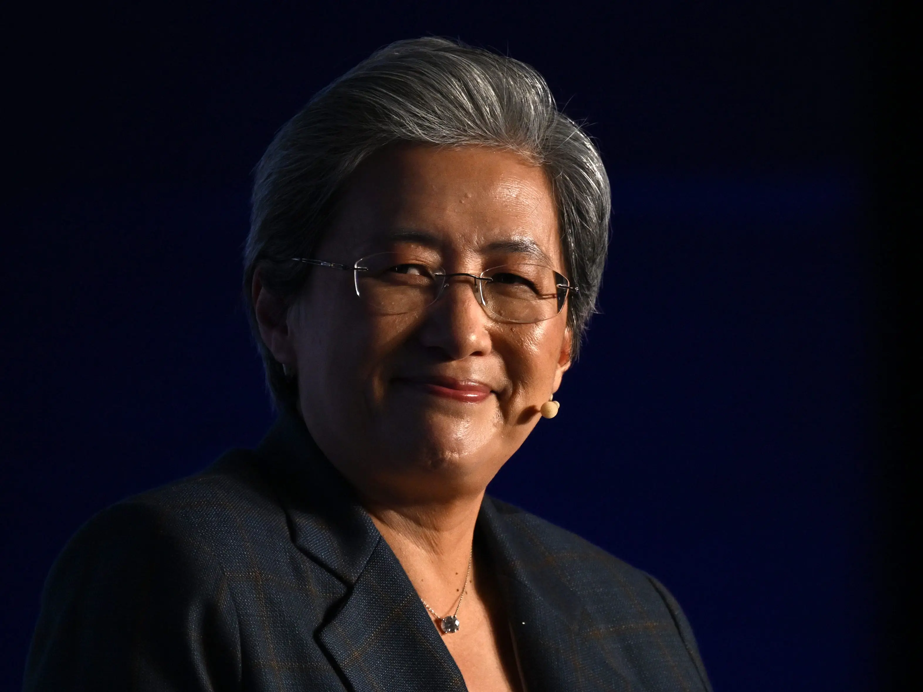 AMD president and CEO Lisa Su at London Tech Week, smiling in front of a black background.