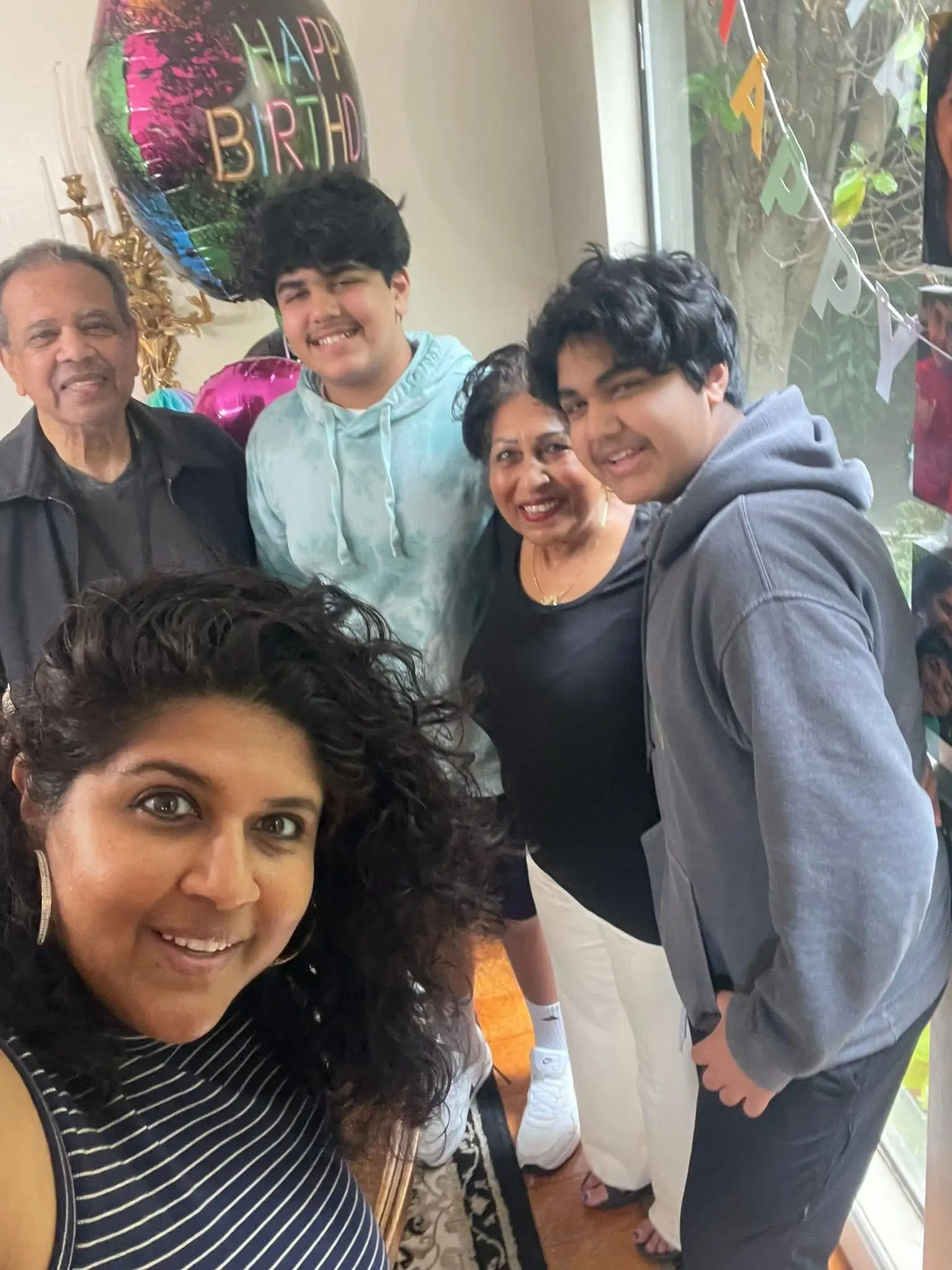 A family of five is celebrating a birthday.